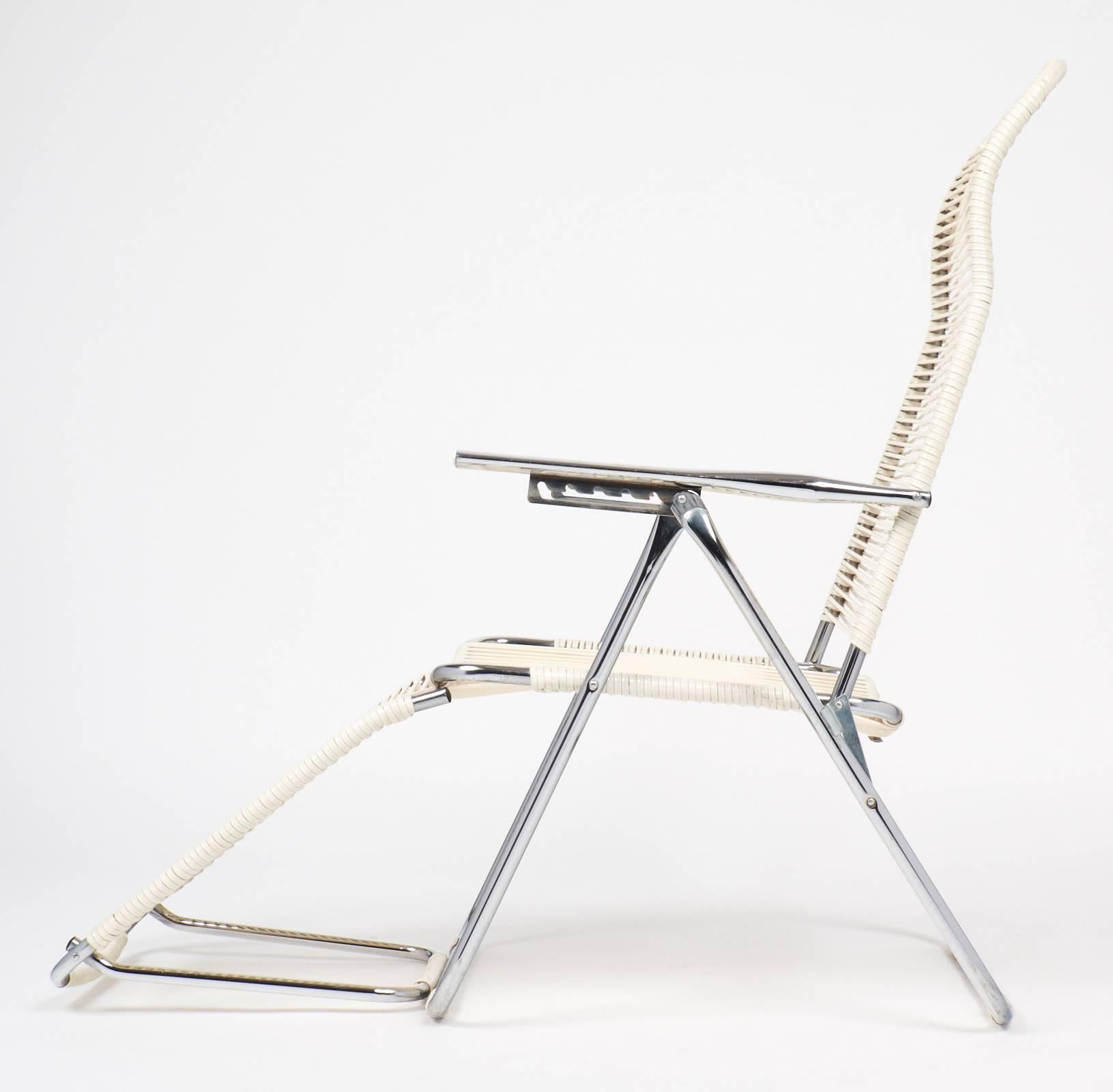 Iconic French vintage adjustable chaises longue chair with chromed steel frame. Measurements are for the chair sitting at the maximum position for the given dimension. Very comfortable and versatile.