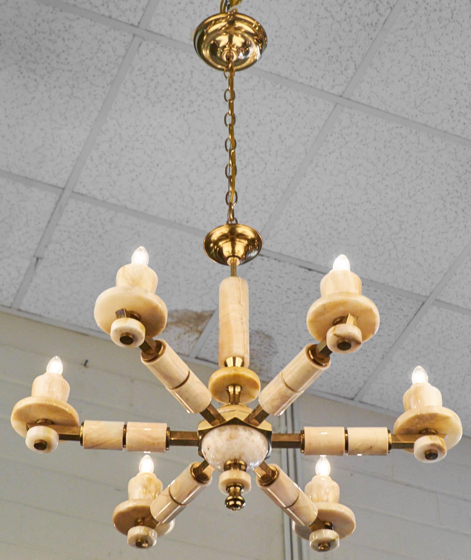 A beautiful vintage onyx and brass chandelier. A timeless piece that creates a stunning balance of materials with a combination of gilt brass and onyx. Rewired for U.S. markets with six candelabra sockets. Height including chain and second canopy is