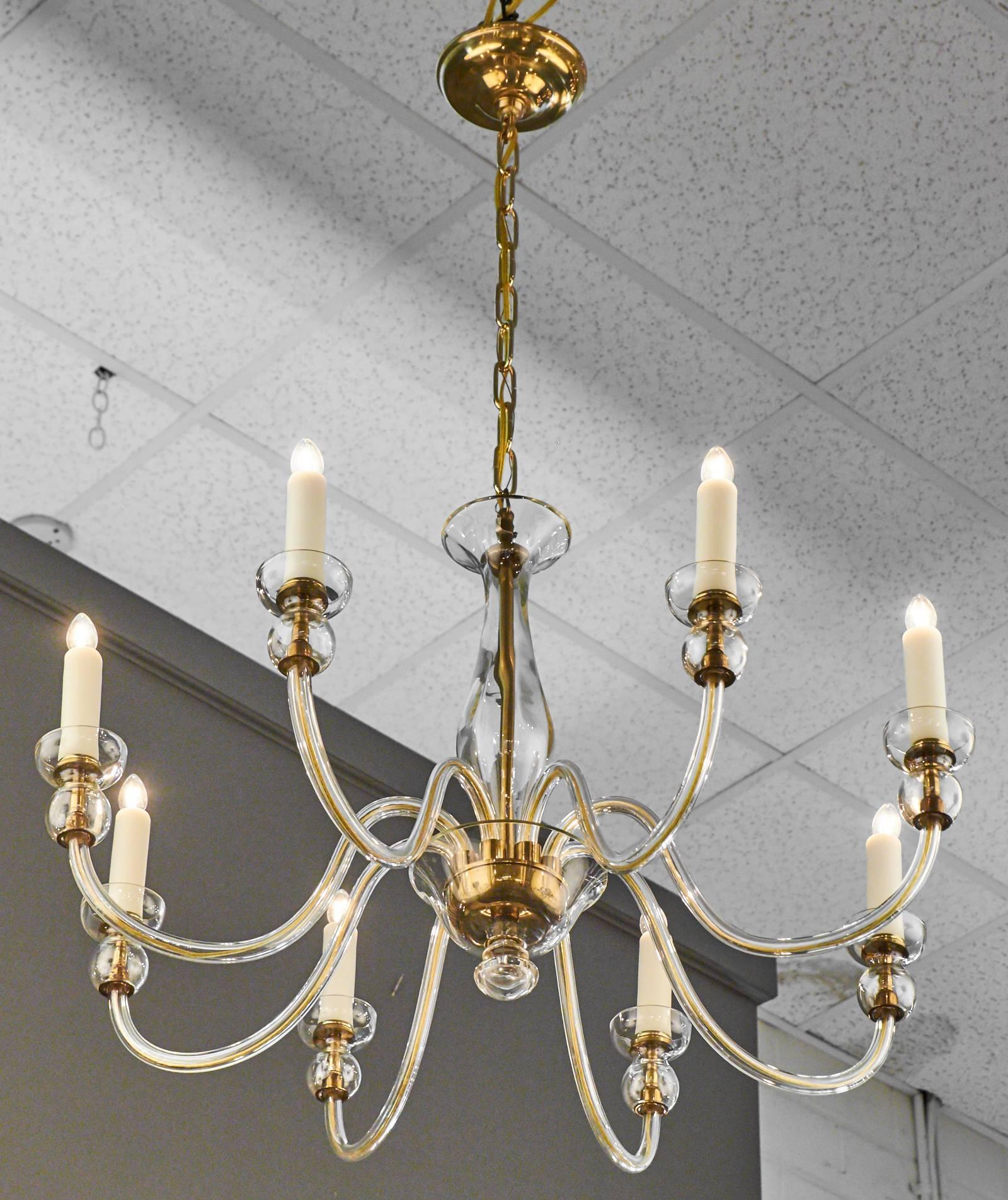 Vintage Murano chandelier with lightly ambered blown glass. Eight gracefully curved branches with beveled cut bobêches. Rewired for US standards with eight candelabra sockets. Height including chain and canopy is 38