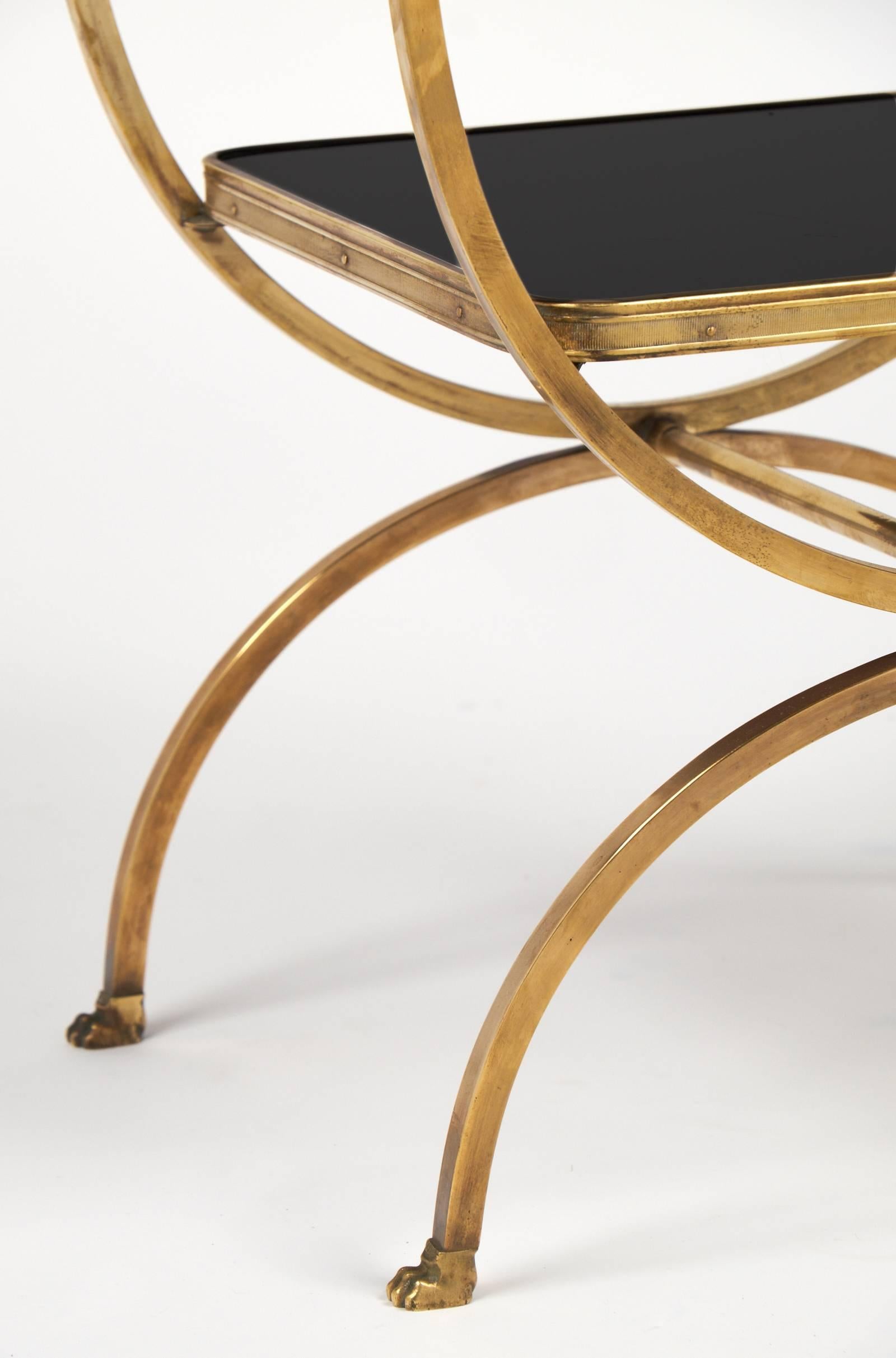 Vintage Brass Curule Side Table with Black Glass Shelves In Good Condition In Austin, TX