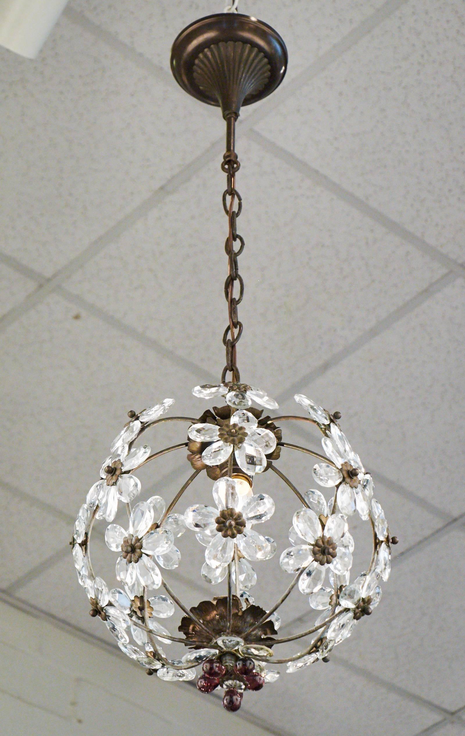 French antique round brass chandelier with crystal flowers. Great attention to detail, with brass flowers on the interiors and amethyst glass petals accentuating the bottom finial flower. Holds one medium base bulb, rewired for the US. Height with