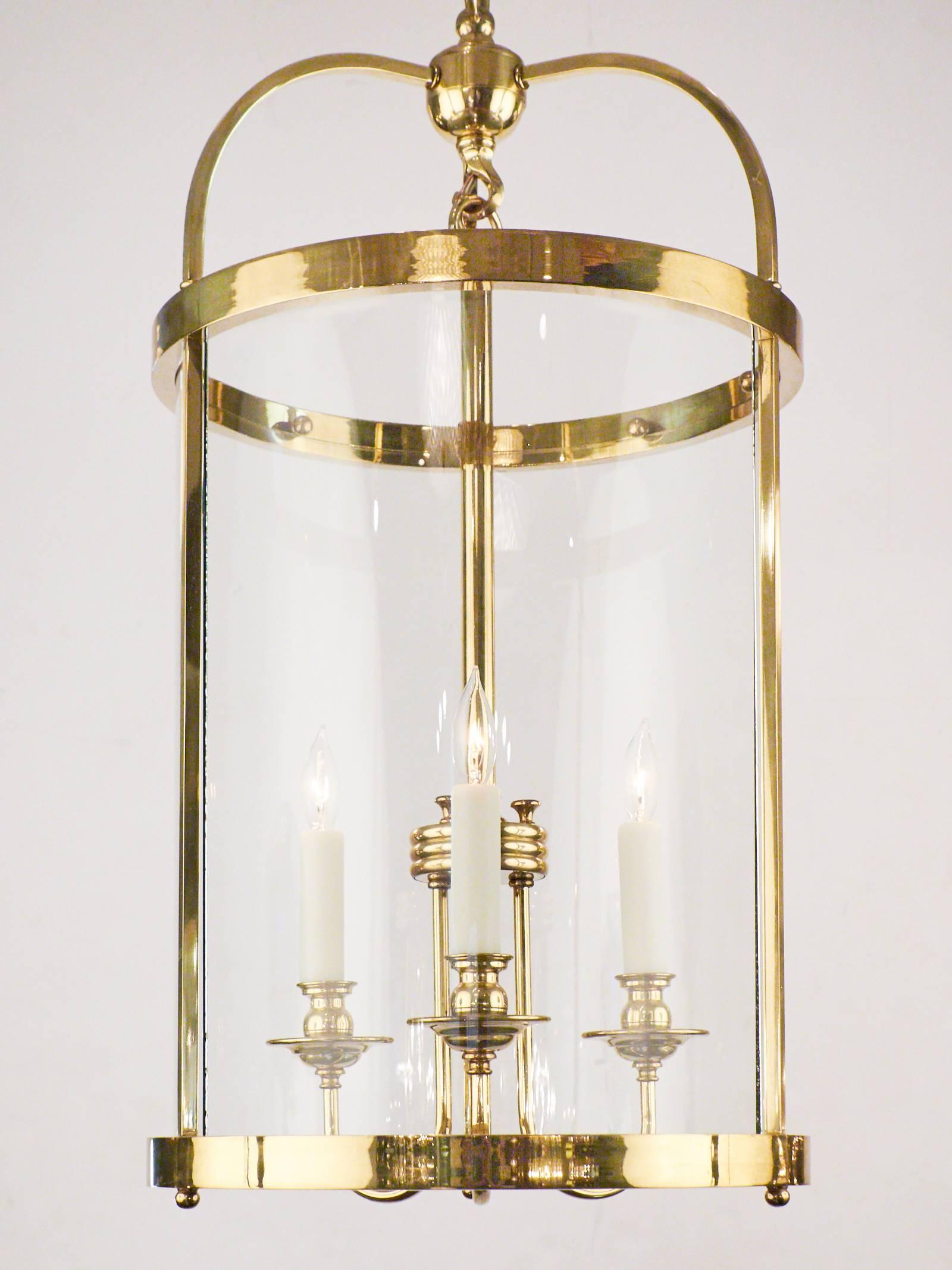 French vintage lantern pendant light in brass and glass with three candelabra lights, rewired for the US. Height with included chain and canopy is 58 1/4