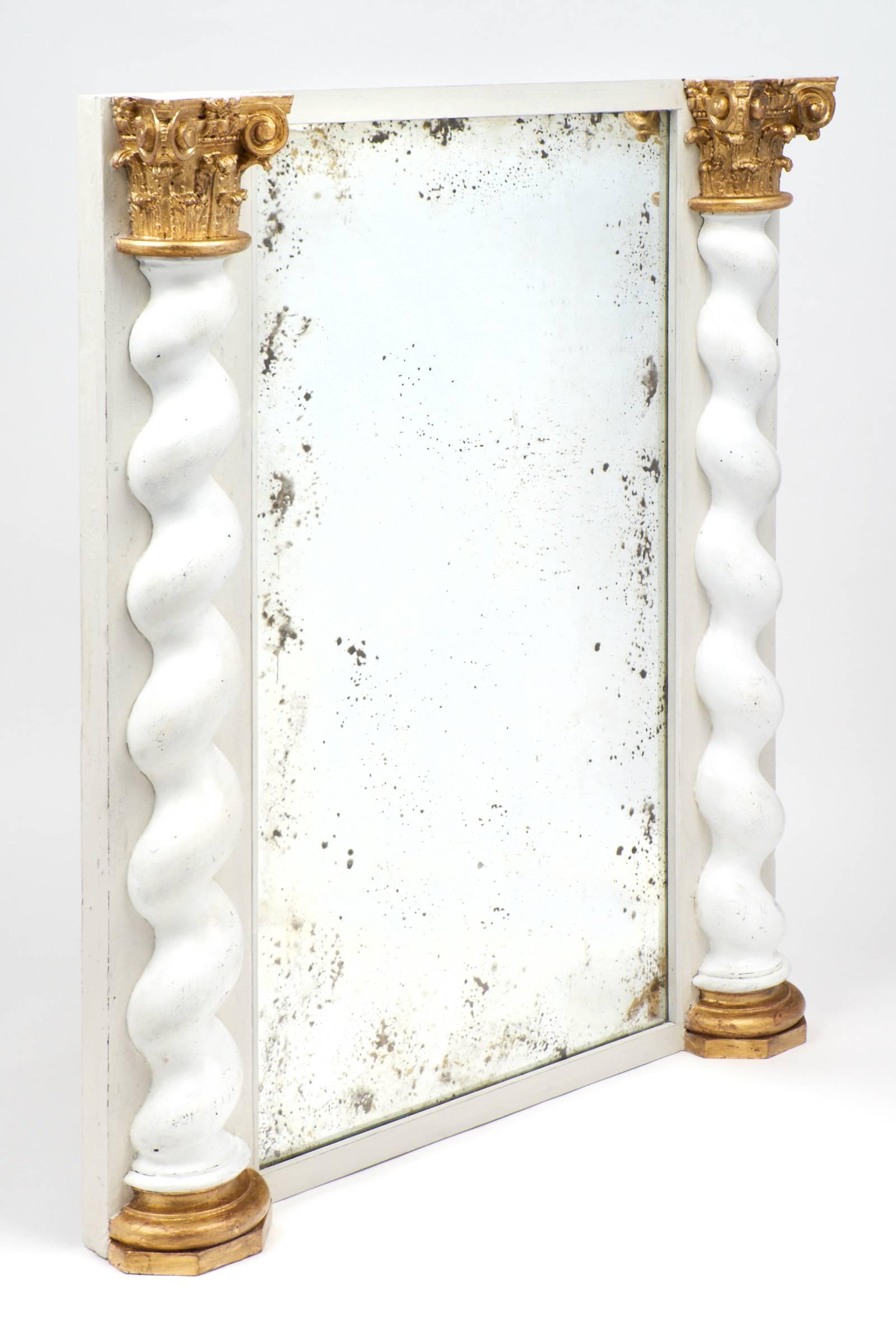 This spectacular antique Italian Baroque mirror combines an antiqued 