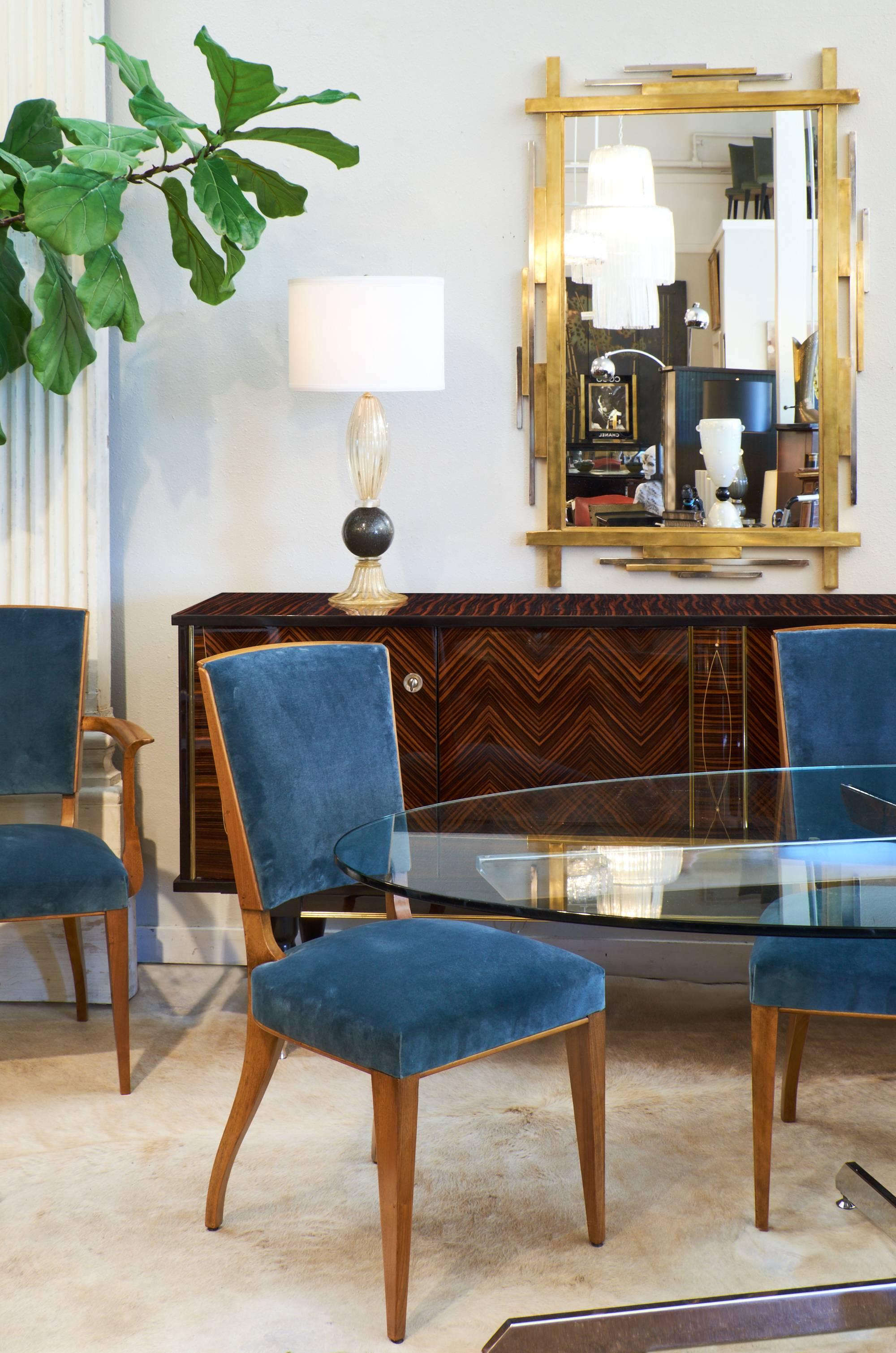 French Art Deco period set of four side chairs and two armchairs. A beautiful set of dining room chairs of solid cherrywood, beautiful profiles, professionally reupholstered in new 100% cotton velvet in 