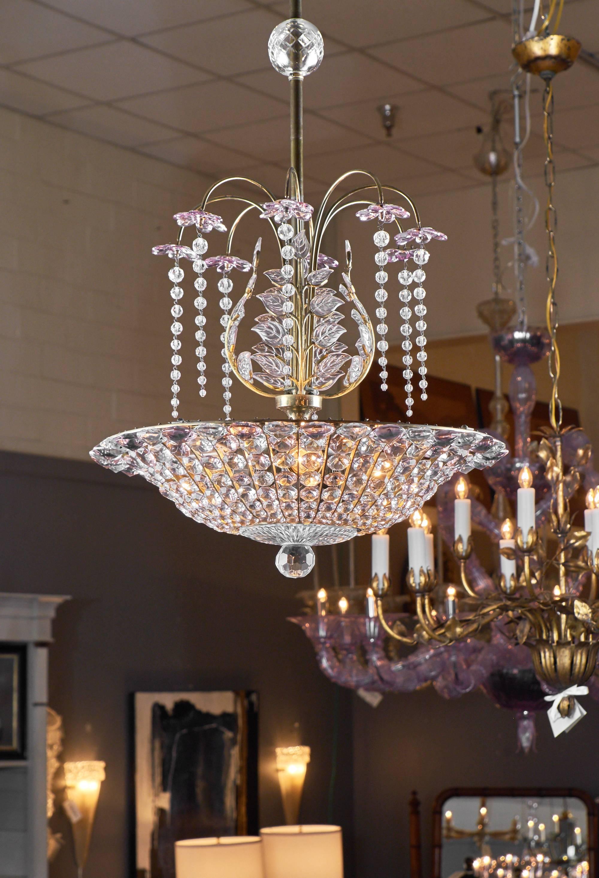 French crystal chandelier attributed to Maison Baguès. This beautiful piece features hanging strings of crystals in the style of wisteria branches and in it's center the crystal leaves iconic to Maison Baguès. The amethyst color and the stylized