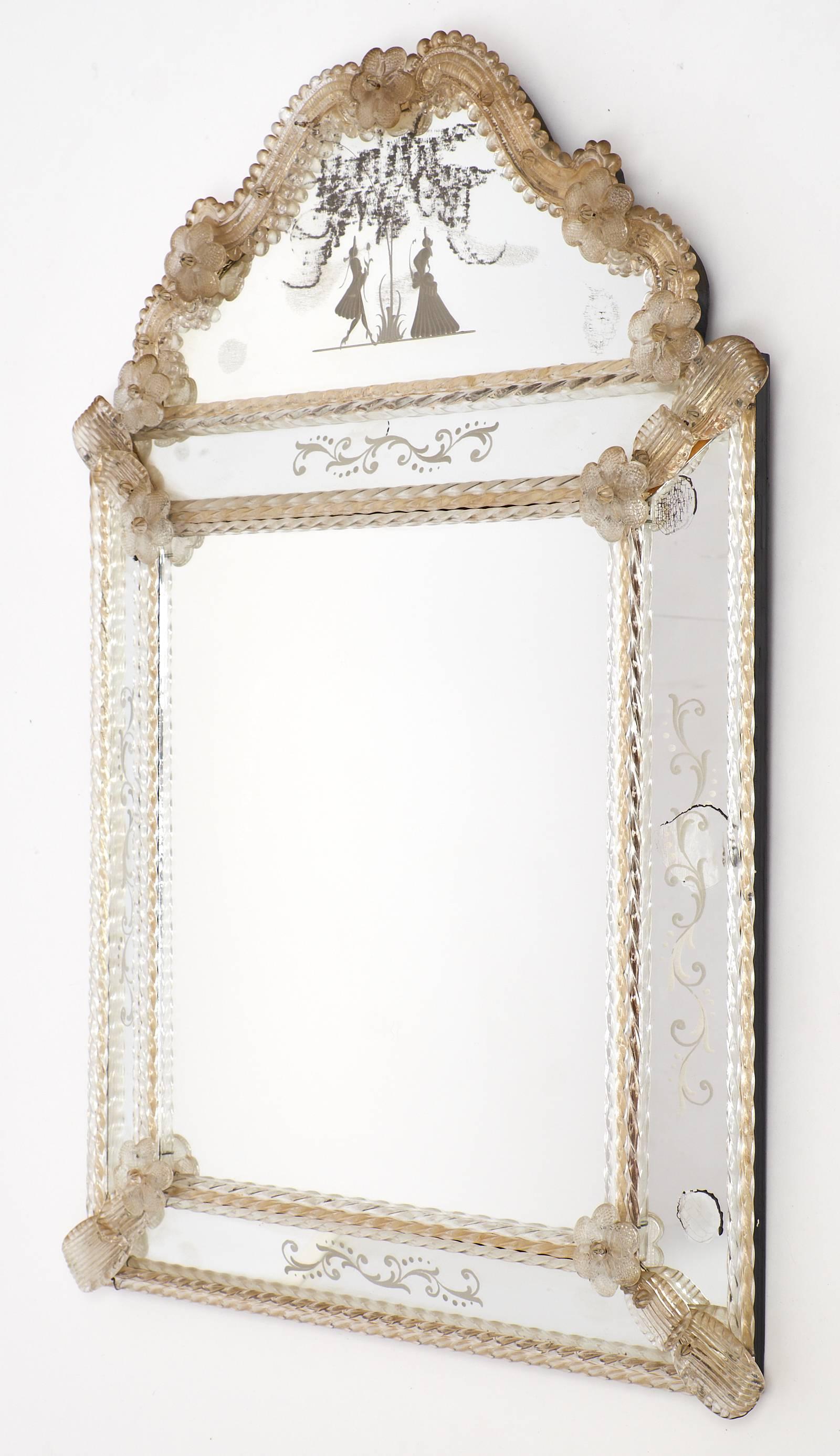 Venetian glass wall mirror with a rectangular central mirror and fronton, smoked glass elements throughout , floral elements, torsadoes. Engraved romantic scene, floral friezes on the mirrored frame. Beautiful condition.