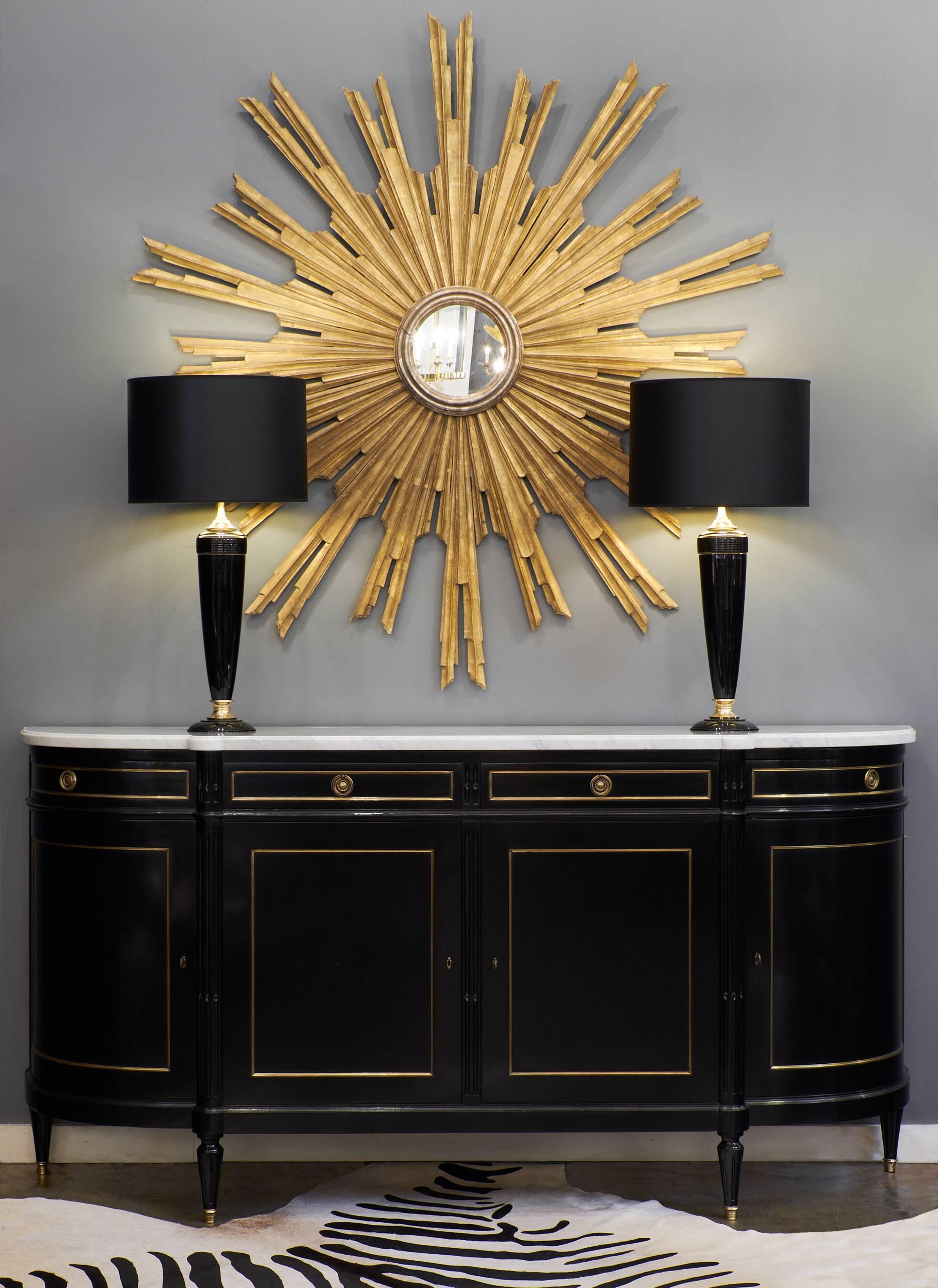 This impressive Louis XVI style ebonized buffet has superb classic lines and tons of decorative impact. The beautiful slab of Carrara marble that tops the piece adds elegance and class. The long buffet has curbed sides, giving it an extended