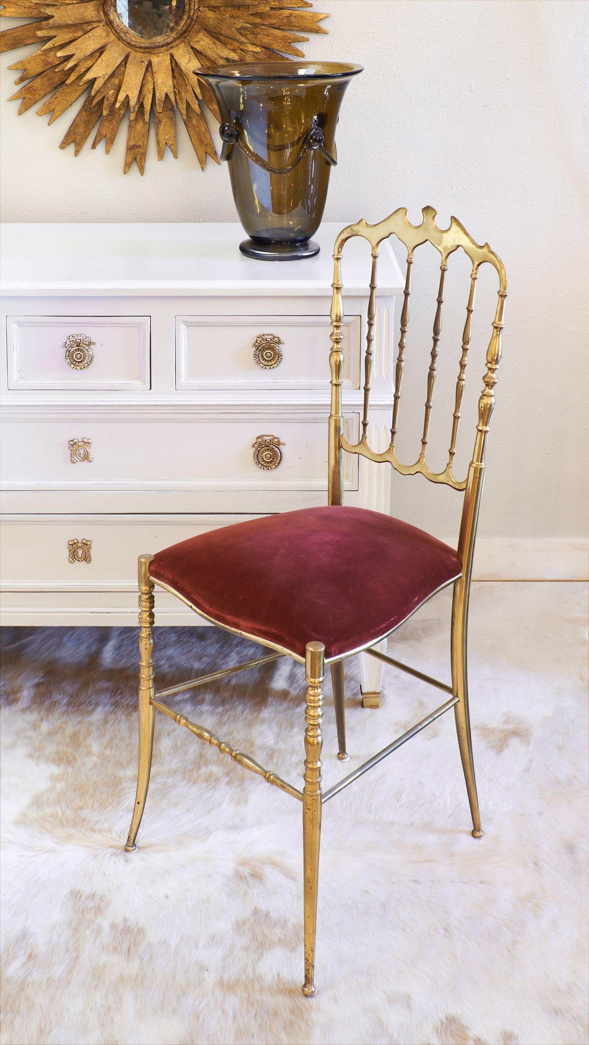 Antique French Directoire style chest of drawers with a lightly patinated dove grey painted finish and white detailing in the fluted columns flanking the centrally located drawers. Gilt brass caps all four feet and beautiful brass hardware stands