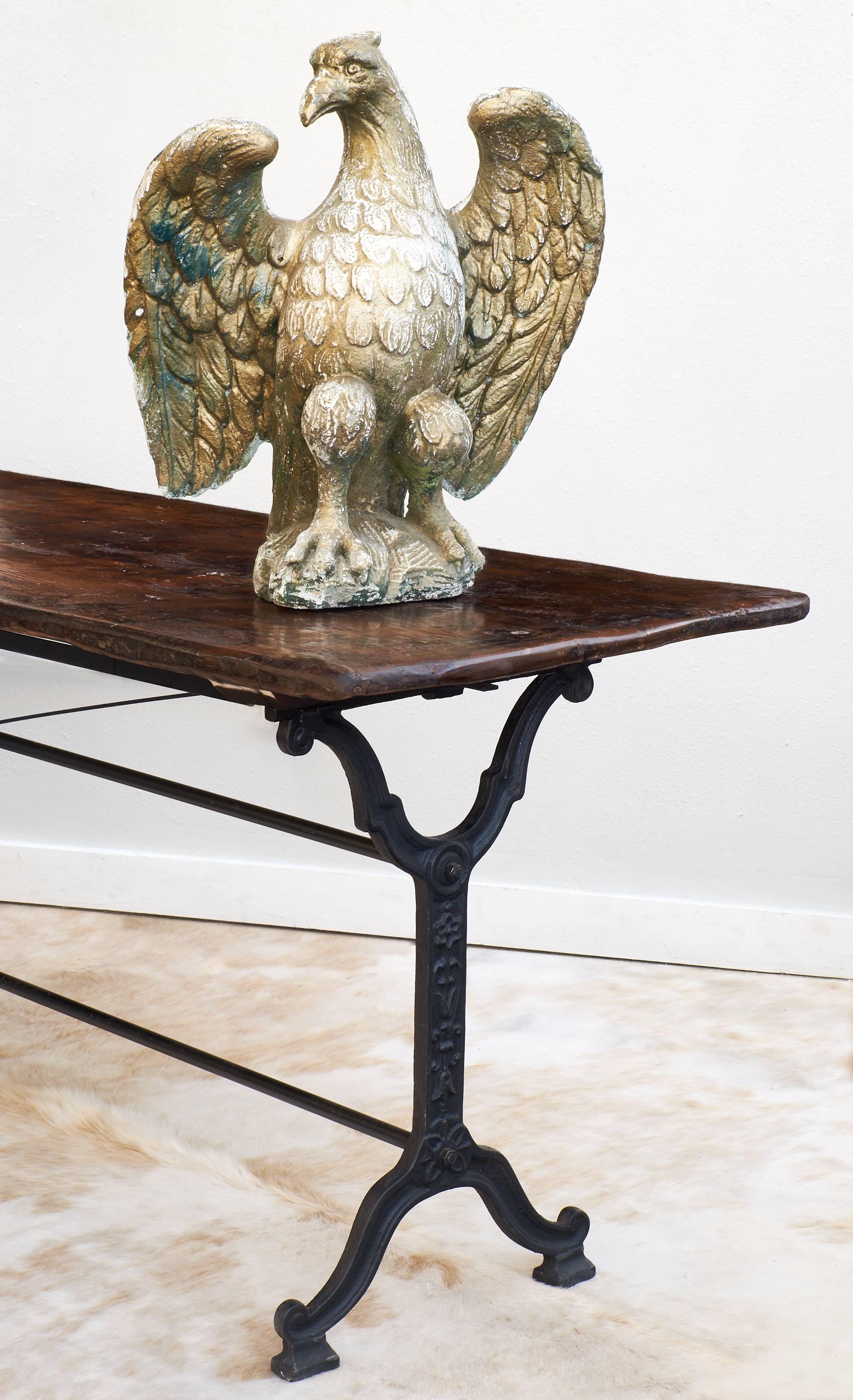 These Empire style eagle sculptures are made of reconstituted stone. The statues have a beautiful patina, and could be used outdoors or in your sun room, circa 1920.