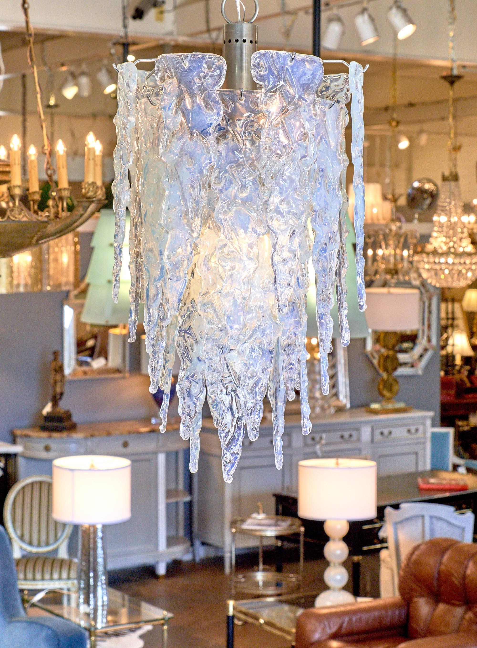 Vintage Murano Glass chandelier with wonderful shape and texture, this Murano glass chandelier has a lot of style and impact. The translucent Murano glass has an iridescence and each piece of overlapping glass is in a stylized icicle shape. This