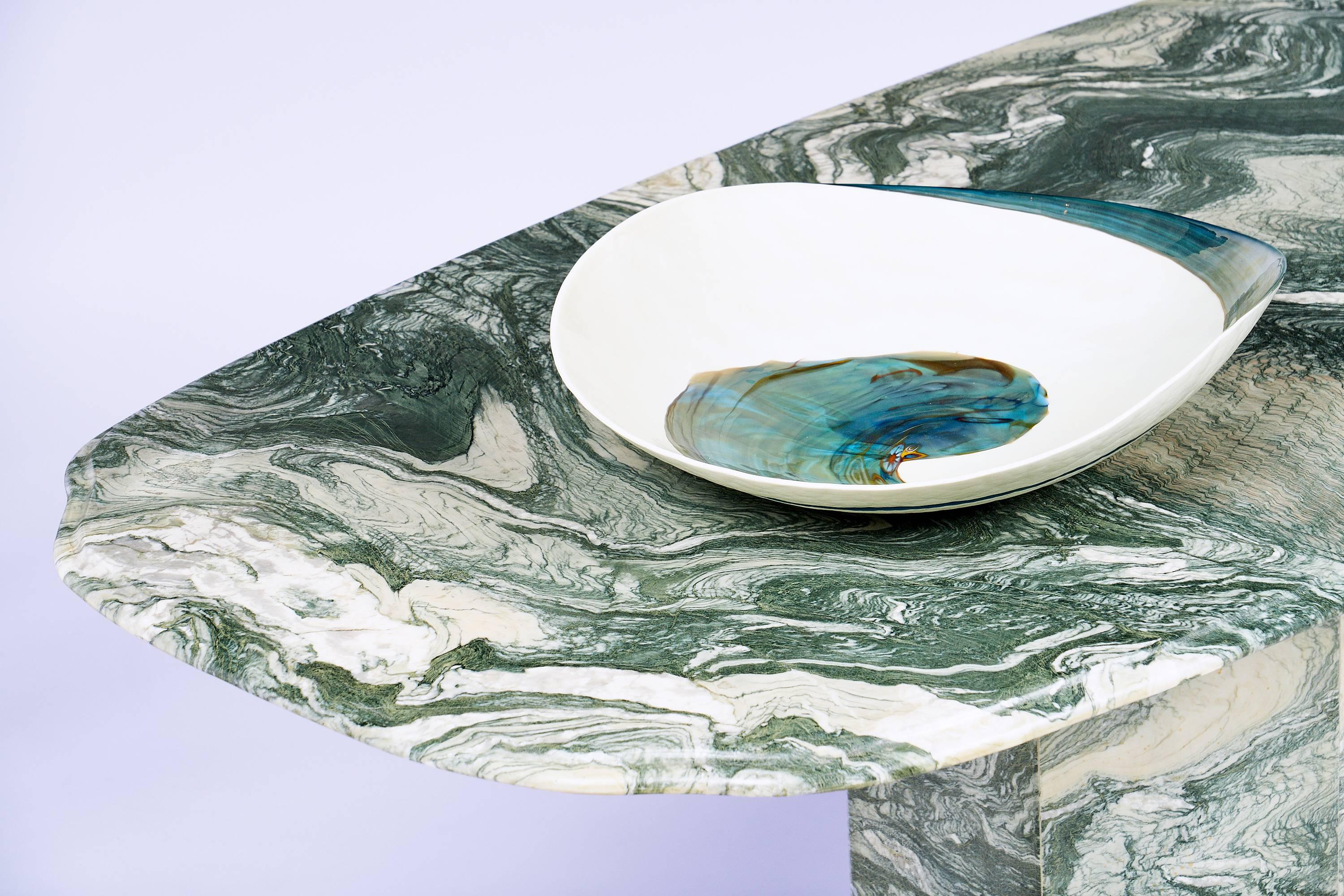 Wonderful Mid-Century Italian Verde Luana marble dining table. This historic and rare marble is extracted from quarries located in northern Italy. We love the unique green color and the intense and bright wavy veins. The top slab is tremendous. This
