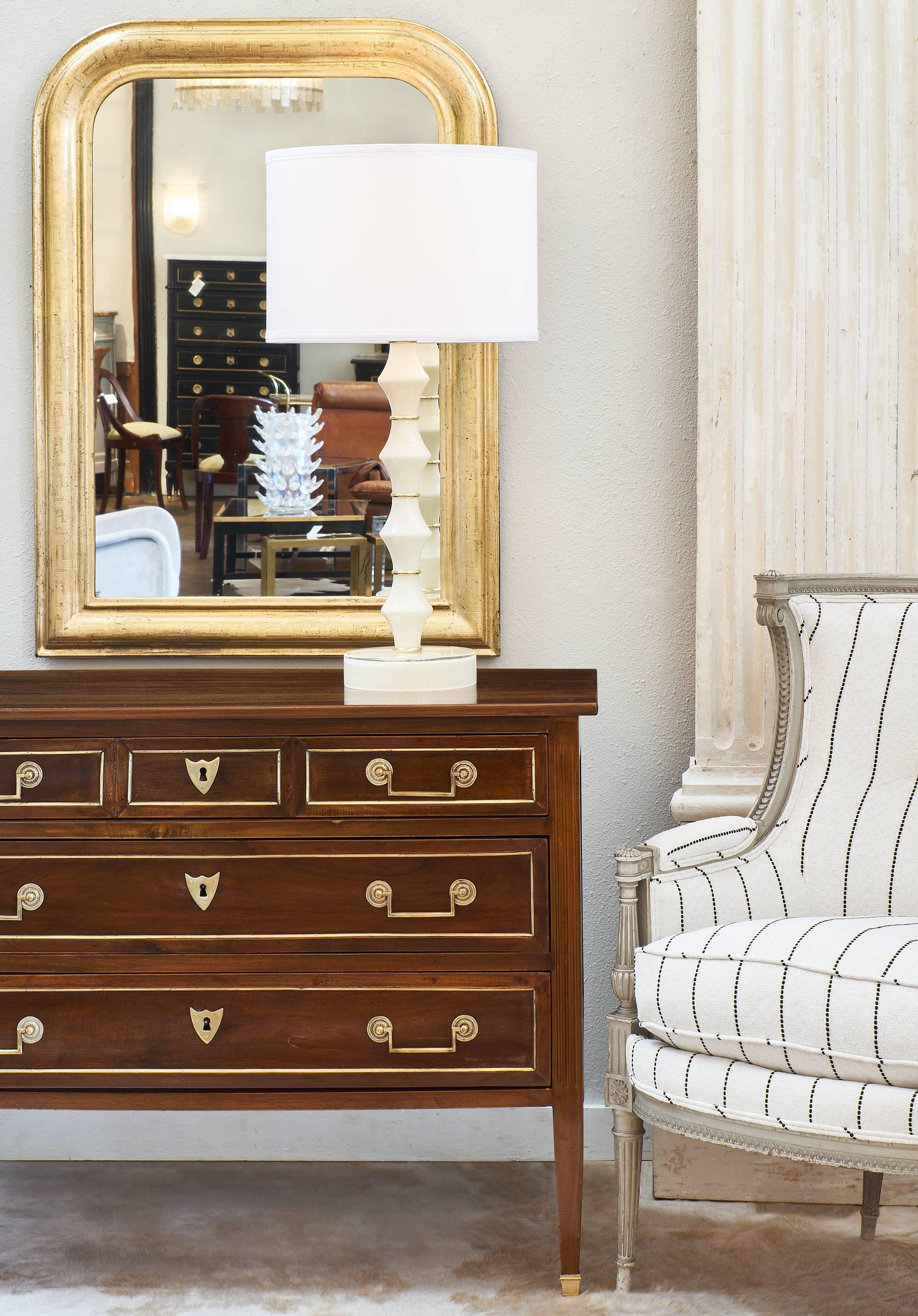 Beautiful Directoire style antique chest made of solid walnut. This Provincial piece features brass hardware, bronze feet, and fluted legs. This is a wonderful chest with great feel and proportions.
  