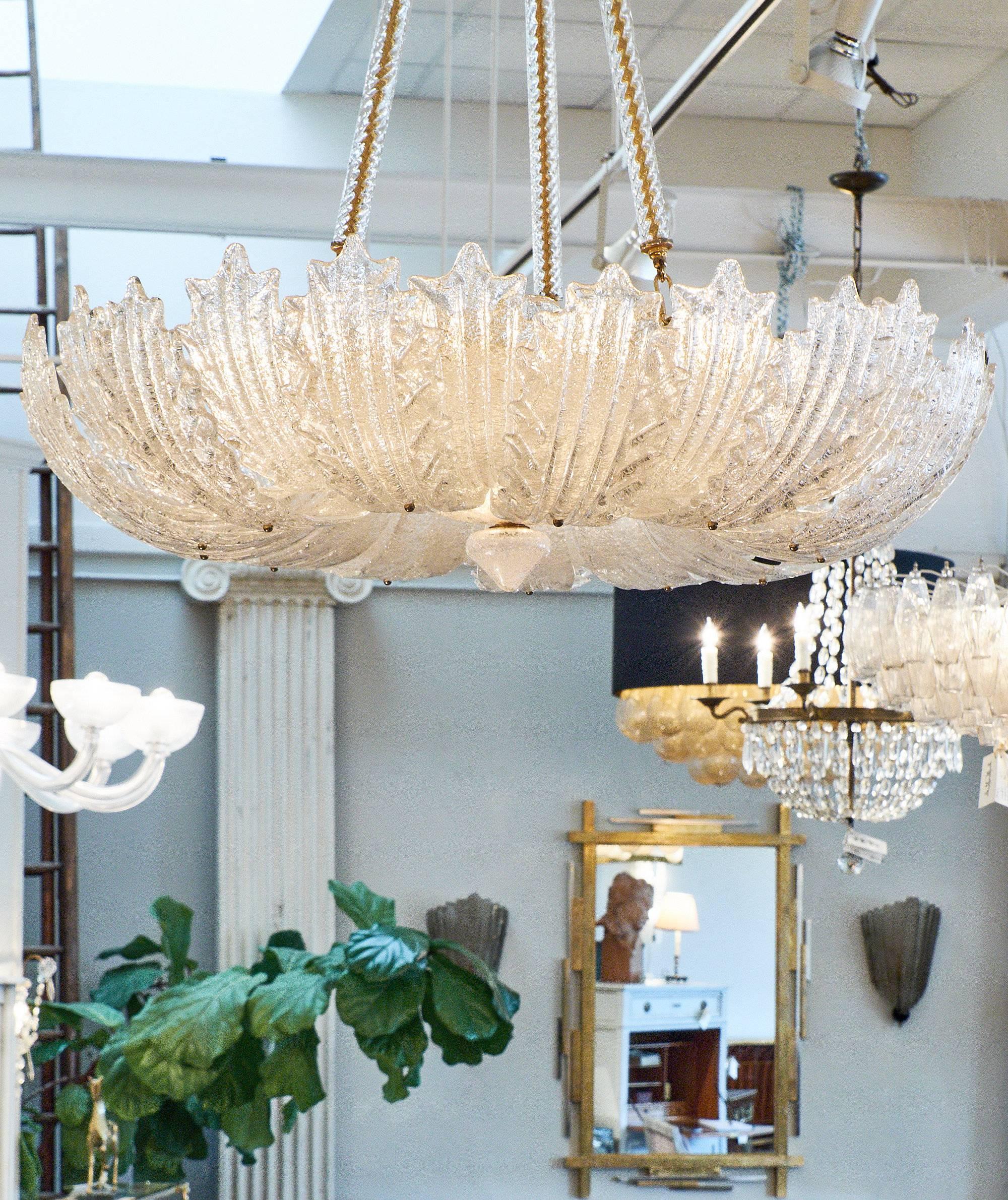 Wonderful Murano glass chandelier with a gilt brass structure. The finely crafted structure has an array of ridged glass 