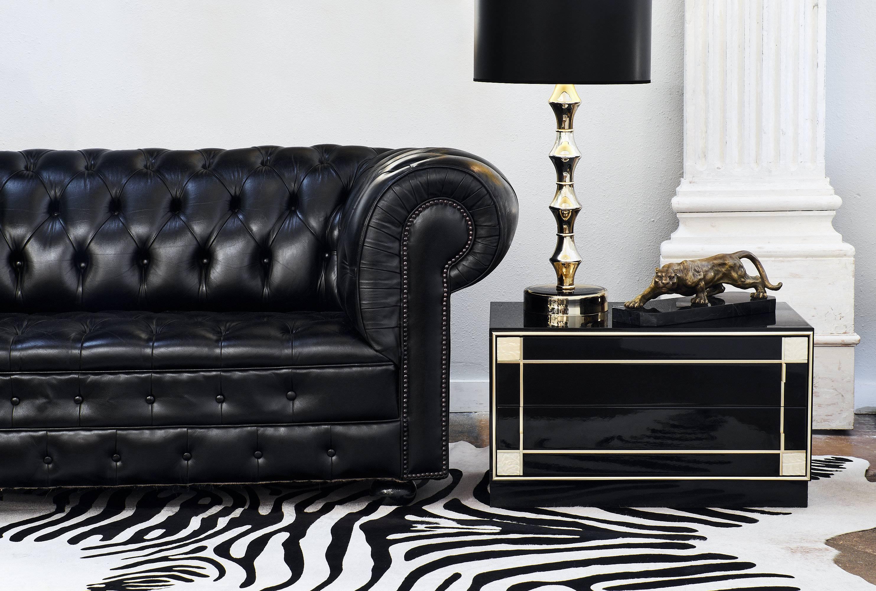 Tufted black full grain leather Chesterfield sofa in superb condition from England. This comfortable and amazing piece has been professionally reconditioned and will be eye-catching in your living space!