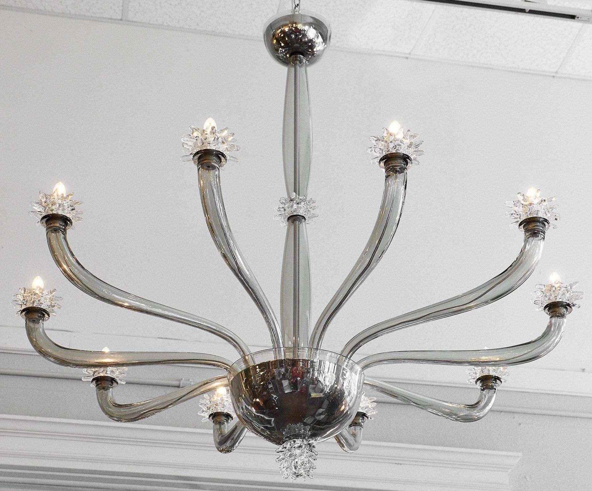 Ten branch chandelier in the manner of Barovier. This piece is a beautiful gray “acciaio” color that is enhanced with iconic rostrate bobèches and components. This chandelier has been rewired for the US market.

This fixture is a special order from