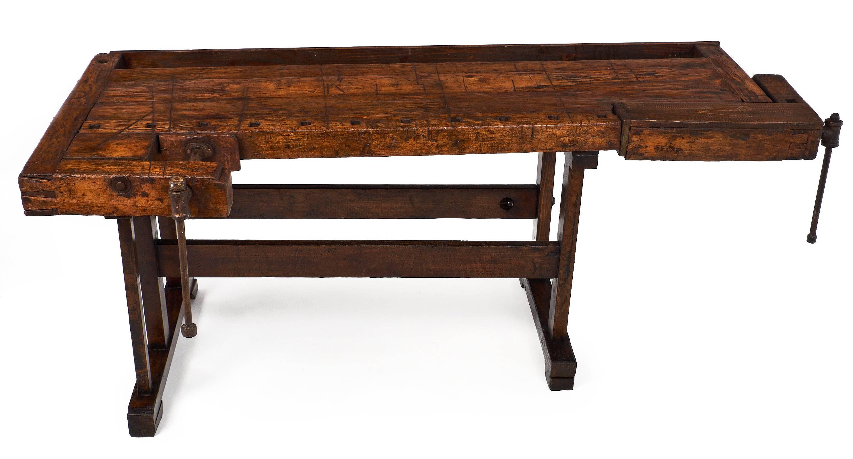 This superb workbench from the French Alps features a stunning patina and many details, circa late 19th century. This table was used to craft some of the first wooden skis. The large piece is very impressive in size and has moving pieces with