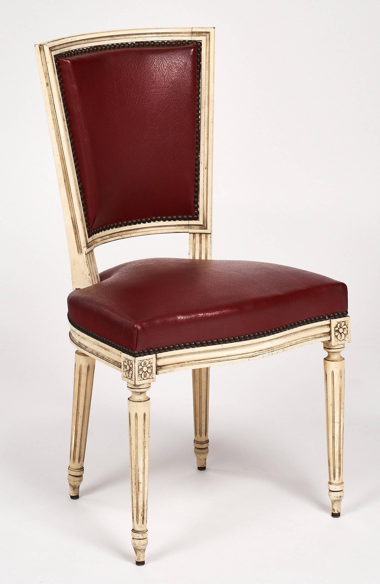 A fine Louis XVI style set of ten dining chairs with original “skaï