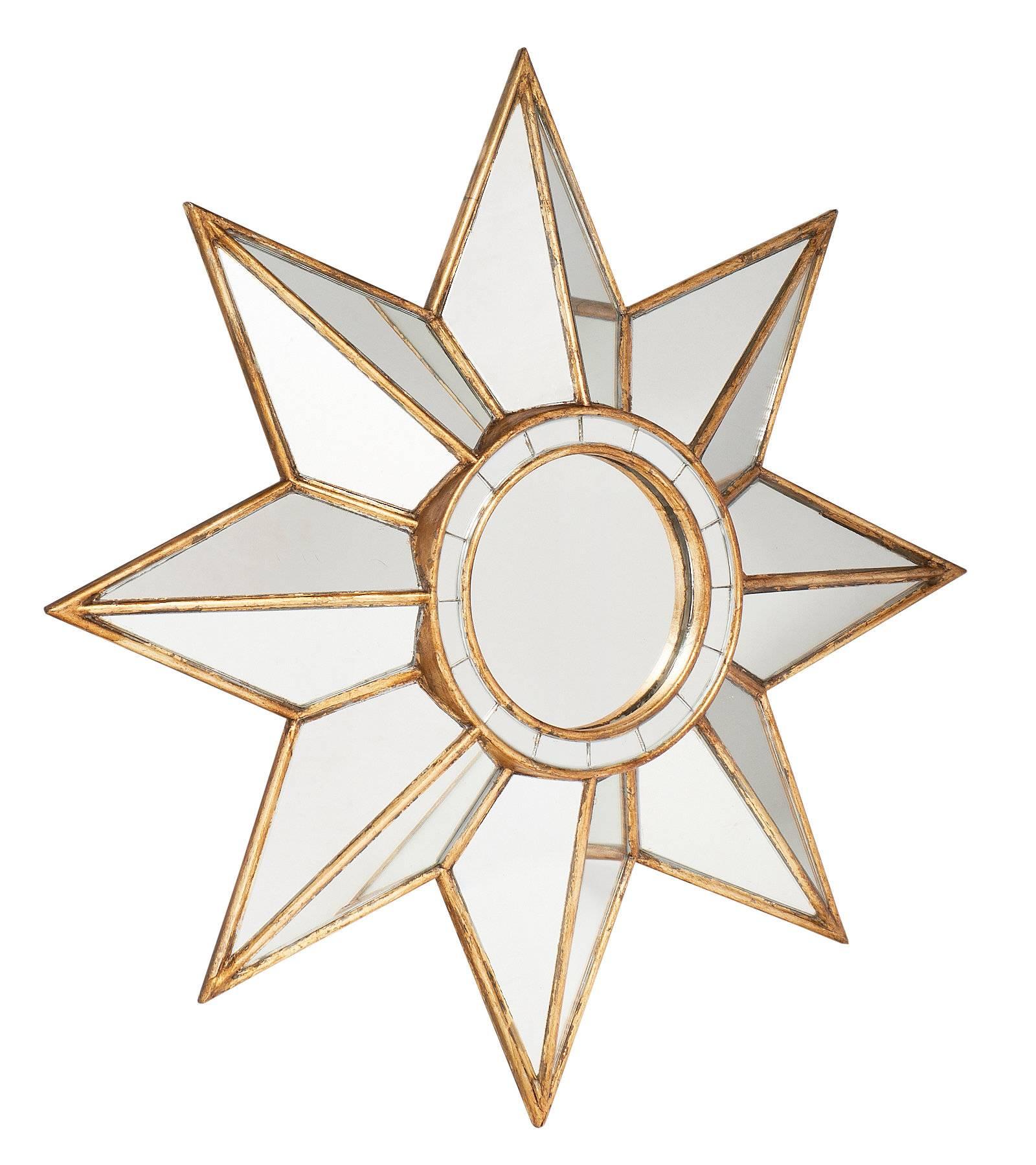 Wonderful star mirror from France. This piece features a central circle mirror, framed by eight points of the star, each also mirrored. We love the size and impact of this lovely piece.