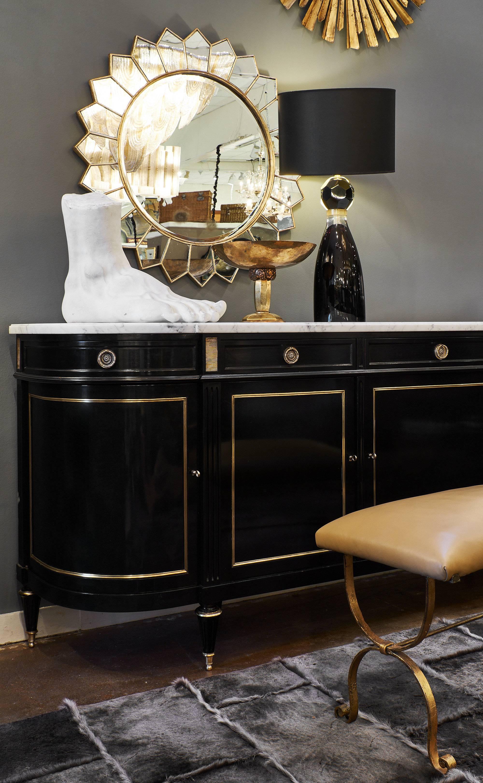 An impressive and elegant Louis XVI style buffet or enfilade made of Mahogany that has been ebonized and Finished with a museum quality, hand-rubbed French polish (the process involves multiple coats of authentic shellac traditionally applied by