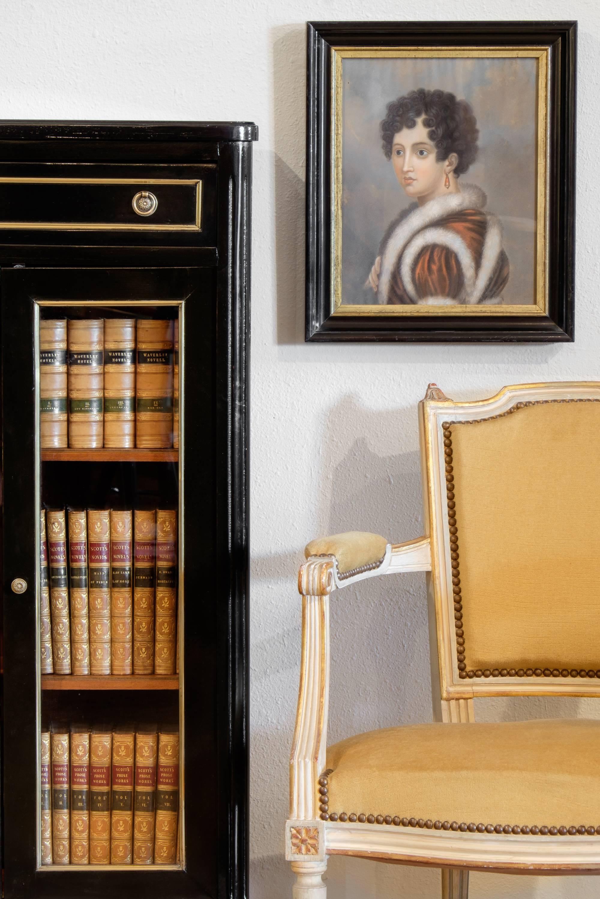 French antique portrait in oils and pastels, framed in a black lacquer and gold leafed wooden period frame, representing Hortense de Beauharnais, the queen of Holland, daughter of Joséphine de Beauharnais, Napoleon's wife. Mother of Napoleon III. A