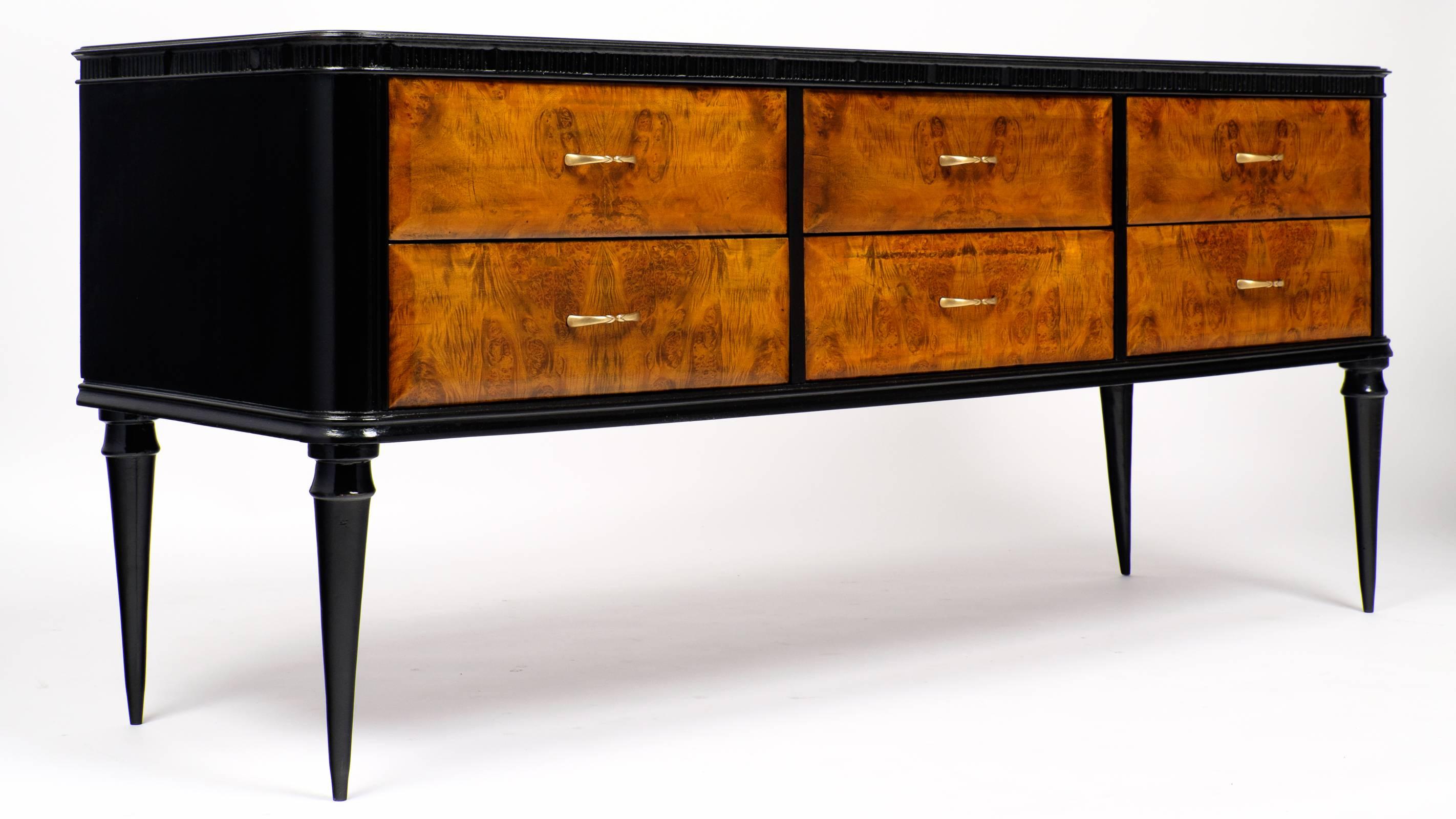 Italian Modernist console/chest in burled elm and ebonized elm with a lustrous French polish, cobalt glass top, and six gorgeous dovetailed drawers accented with original bronze hardware. We love the low profile, perfect against a wall or behind a