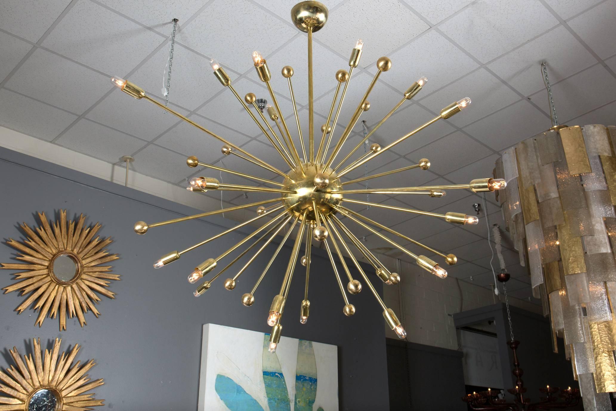 Vintage Italian Midcentury Modern style "Sputnik" chandelier in brass.
Holds 22 candelabra base bulbs, rewired for the US.