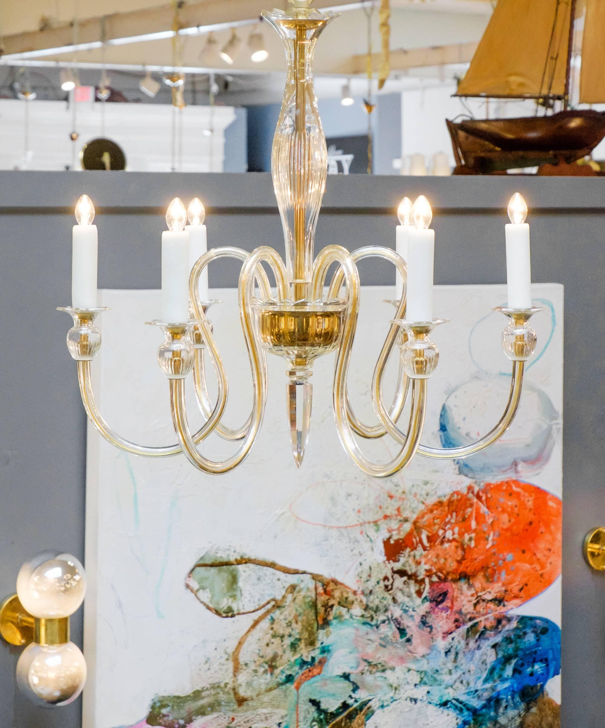 A modern Italian Murano amber glass chandelier with six branches. A very elegant and pure design in the manner of Seguso with beautiful curves. The lovely form of the chandelier is accentuated with refined details and classically-inspired shape.