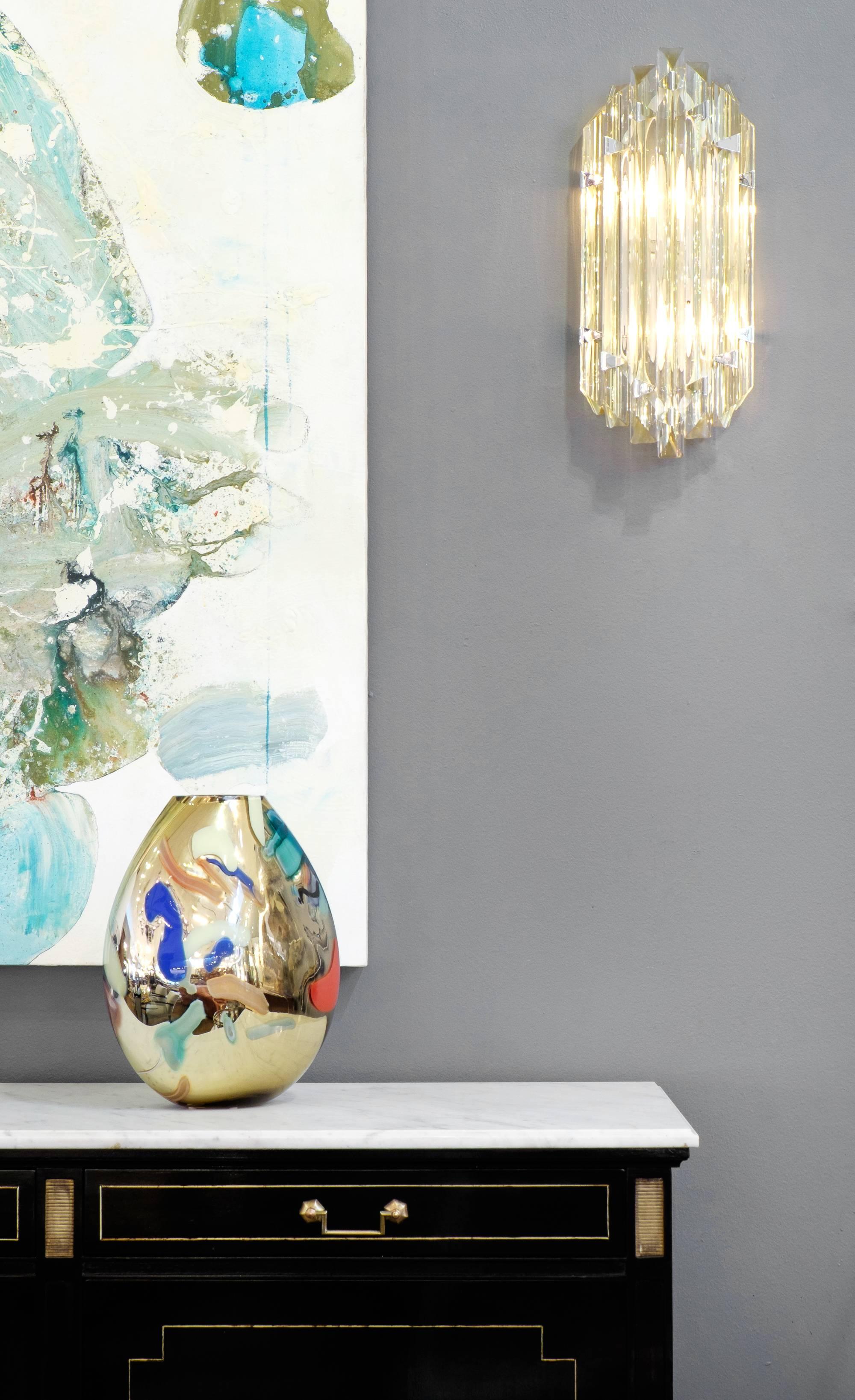 Luminary yellow tinged pair of Murano citron and clear glass marquise sconces in the style of Venini. This glittering pair of large flush mount sconces feature seven long prism 