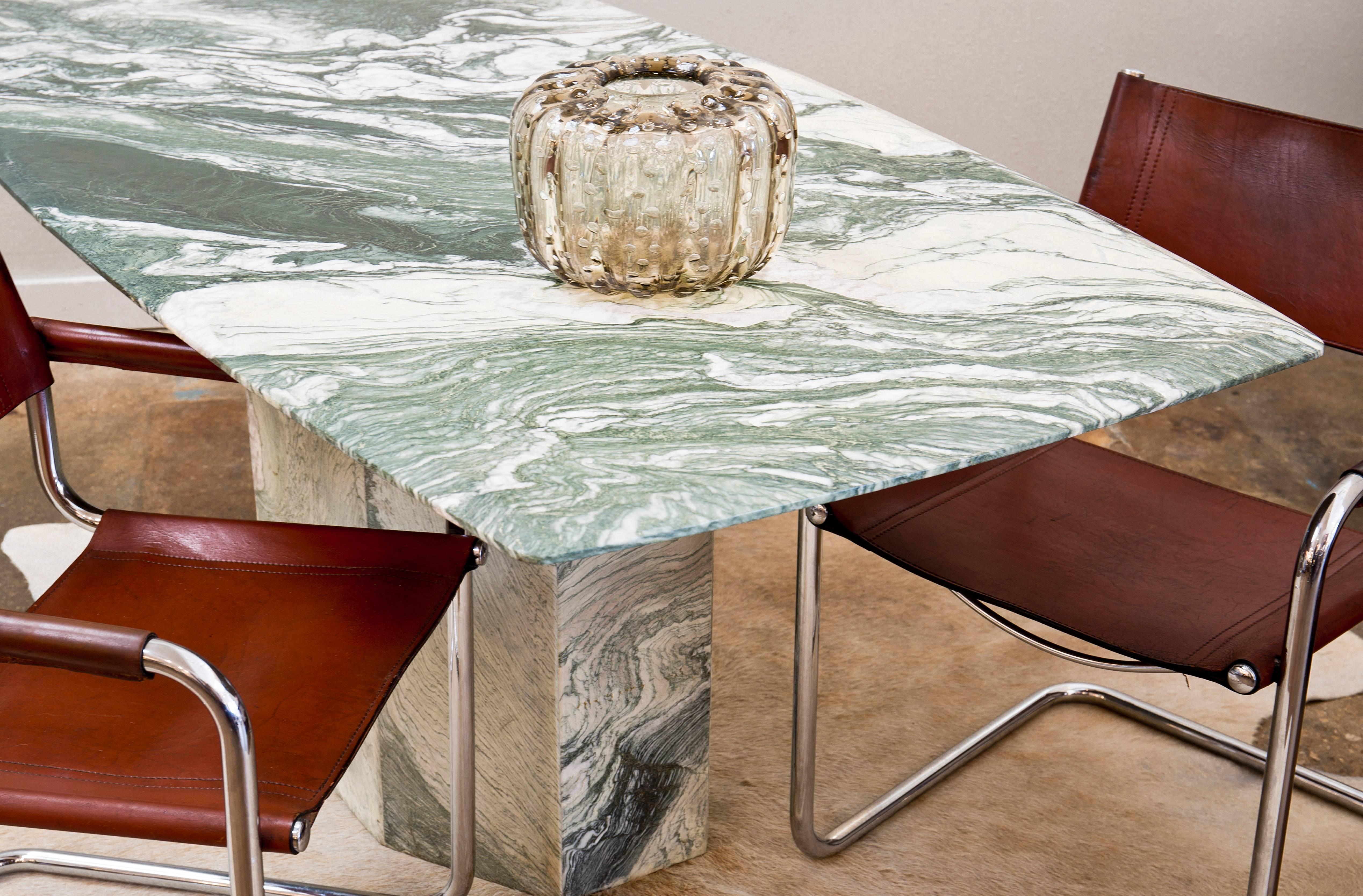 Stunning Verde Luana marble dining room table. Verde luana is a historic marble extracted in quarries located in Northern Italy. We couldn't resist the unique green color, bright and intense and the wavy veins. The top slab is just tremendous.