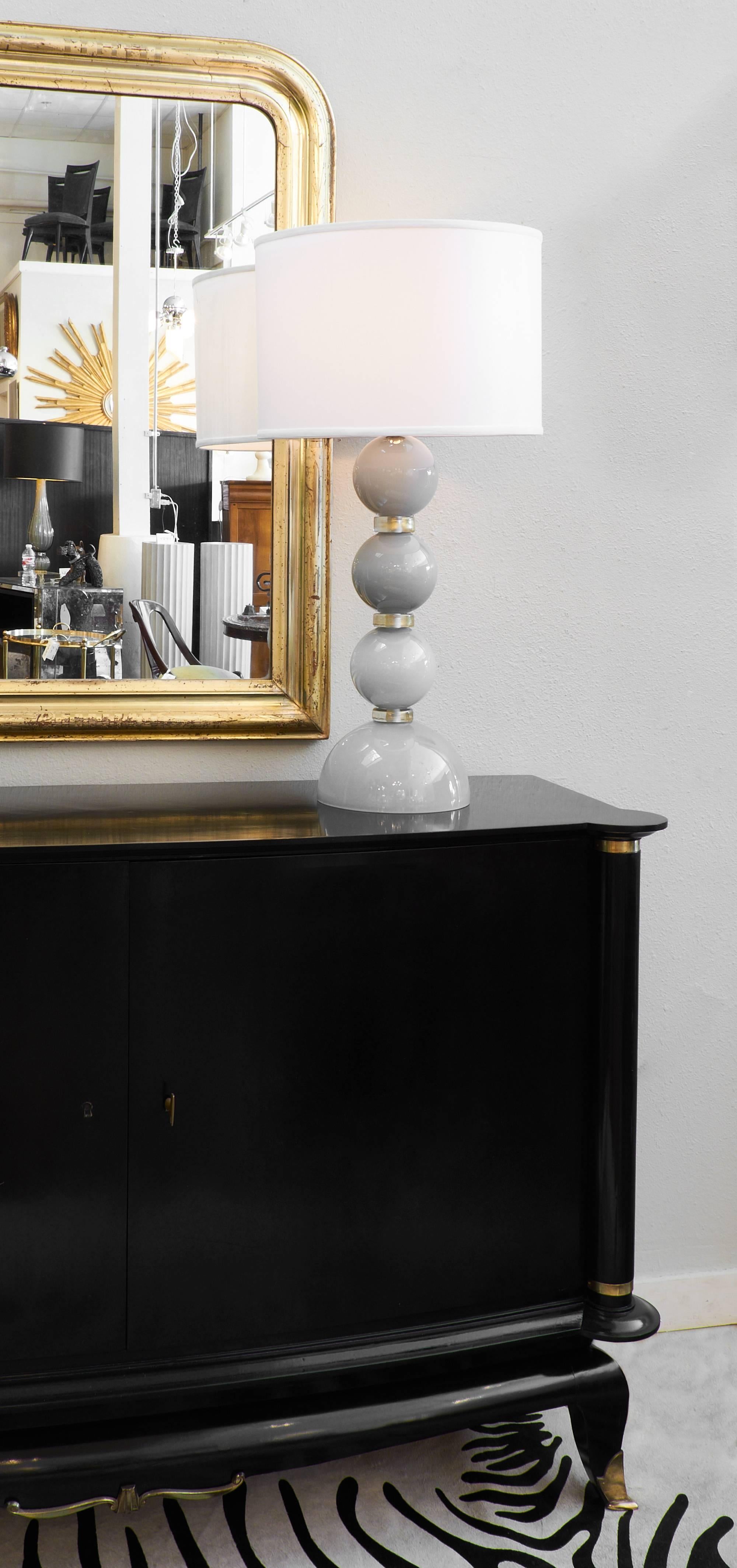 This is a beautiful pair of dove gray table lamps made of Murano glass. Handblown layers of clear glass over layers of grey glass create this beautiful, rich effect. The lamps have been rewired for the US market and the height to the top of the