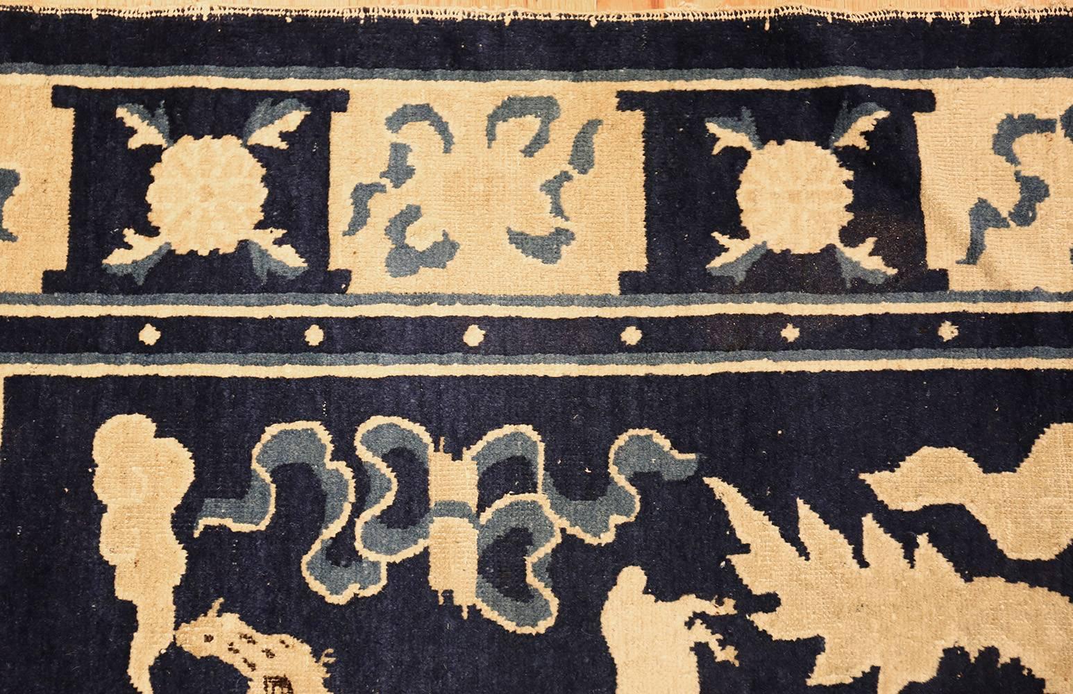 Rare and collectible antique blue Chinese Zodiac rug, country of origin: China, date circa 1900. Produced in breathtaking azure that has been paired with ivory, this antique Chinese rug depicts the familiar animals symbols of the Chinese zodiac. A