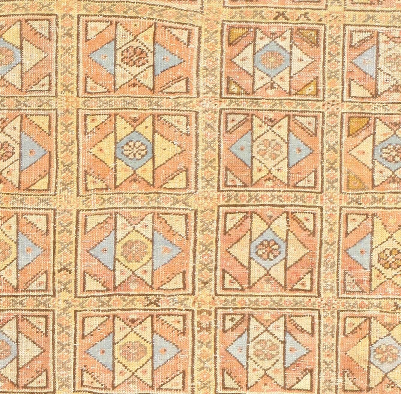 Square Size Antique Decorative Turkish Oushak Rug, Country of Origin: Turkey, Circa date: 1900. Size: 6 ft 8 in x 6 ft 8 in (2.03 m x 2.03 m)

This square, honey-toned antique Turkish rug features a central design of crossed parallelograms, each