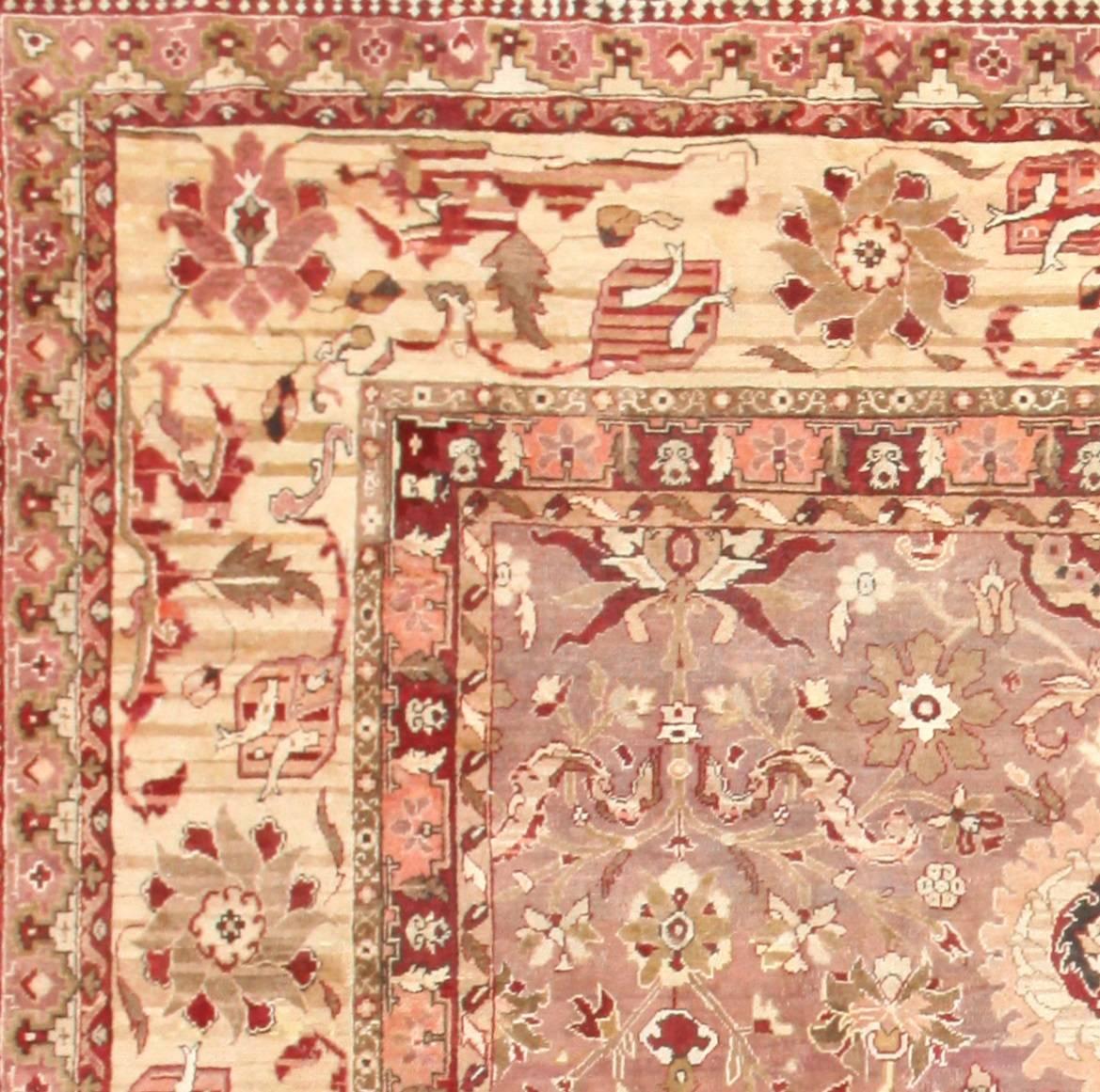 Large Square Size Mauve Colored Background Antique Indian Agra Rug, Country of Origin: India, Circa Date: 1900. Size: 13 ft 6 in x 13 ft 6 in (4.11 m x 4.11 m)

This beautiful antique Indian Agra rug features a broad surface area, which provides the