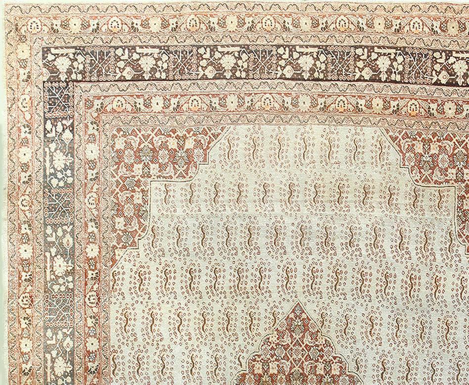 Antique Persian Tabriz rug, country of origin: Persia, date circa 1920. Size: 8 ft x 10 ft 8 in (2.44 m x 3.25 m)

Tabriz has historically been home to some of the finest rug artisans in the Persian world, and this gorgeous antique Tabriz rug is no