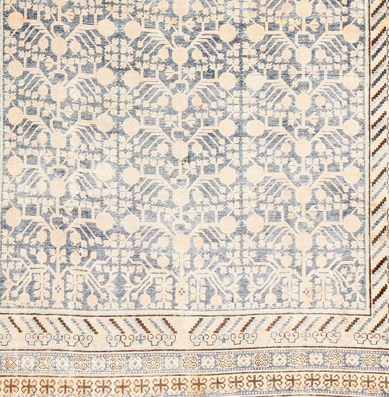 Antique rugs from the city of Khotan have a style that is all their own. These exceptional rugs make the legends of Marco Polo and the Silk Road come alive. Khotan is an oasis and an age-old center for international design. From the ornate borders