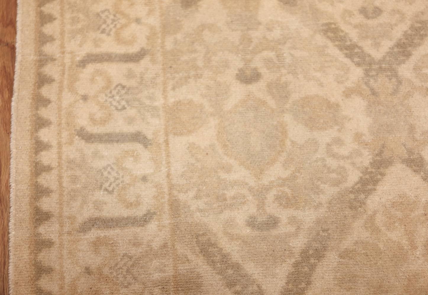 Ivory Background Colored Vintage Spanish Rug, Country of Origin: Spain, Circa Date: Middle of 20th Century. Size: 11 ft 8 in x 14 ft 1 in (3.56 m x 4.29 m)

This vintage Spanish rug delivers an antique tone, its pattern lightened and hazy like a