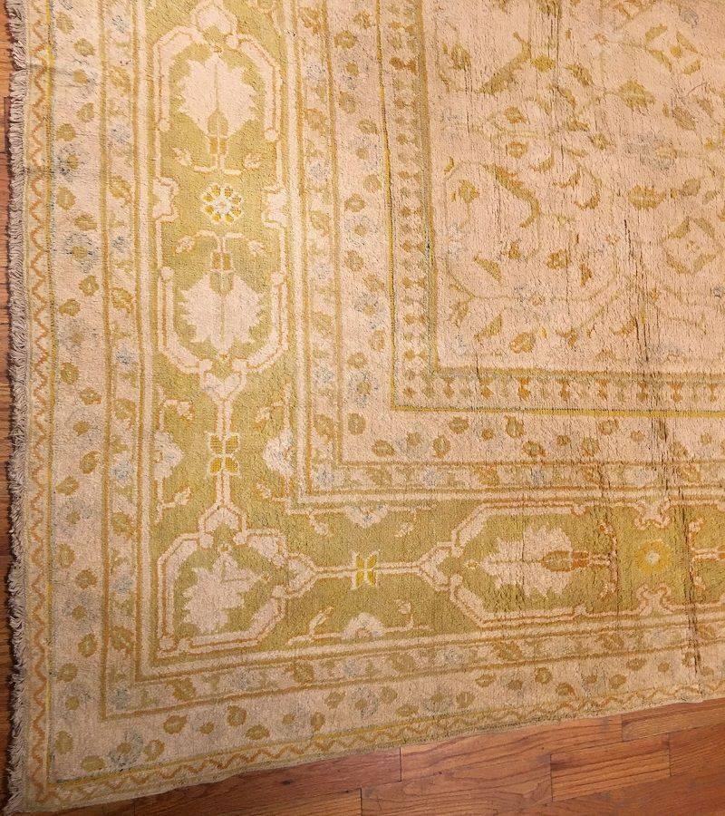 A delicate design of whispy, flowering vines repeats in staggered array across the field of this supremely elegant antique Agra.

Large Oversized Ivory Background Antique Agra Rug, Country Of Origin: India, Circa Date: Late 19th Century – A delicate