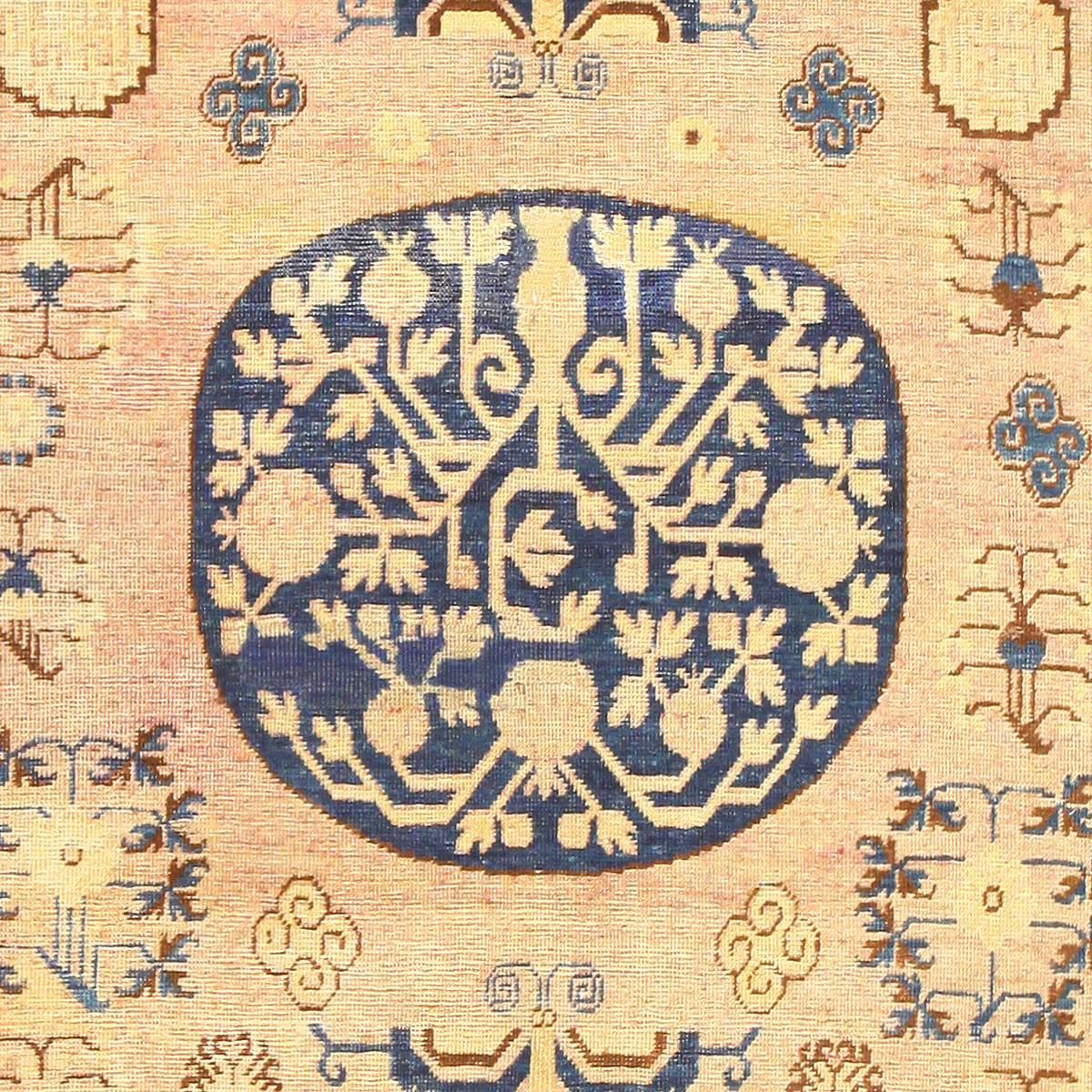 Antique Khotan Rug, Country of Origin / Rug Type: East Turkestan Rugs, Circa Date: Early 20th Century – Size: 6 ft 6 in x 13 ft 2 in (1.98 m x 4.01 m)

Flowing lines define the majority of this Khotan rug’s presence, and the relatively simple color