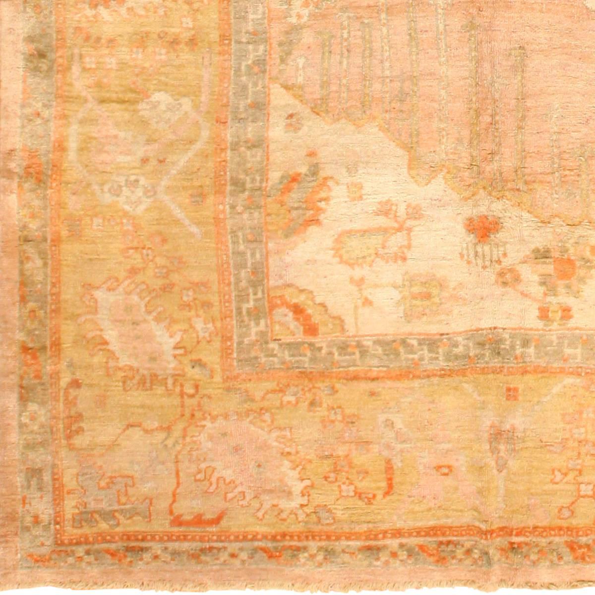 Decorative Antique Turkish Oushak Rug, Country of Origin / Rug Type: Turkish Rugs, Circa Date: 1900. Size: 13 ft 3 in x 15 ft 9 in (4.04 m x 4.8 m)

Soft apricot defines the field of this beautifully faded antique Turkish Oushak rug. The design