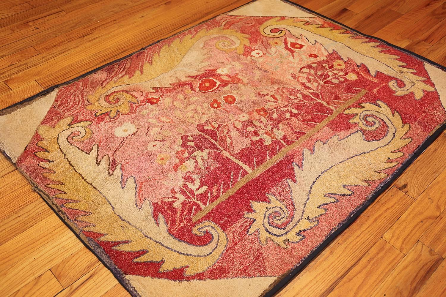 Beautiful and rare antique American hooked rug, country of origin / rug type: Antique American rugs, circa early 20th century. Shaded with the soft hues of a summer sunset, this antique American Hooked rug is a warm and welcoming piece for any cozy
