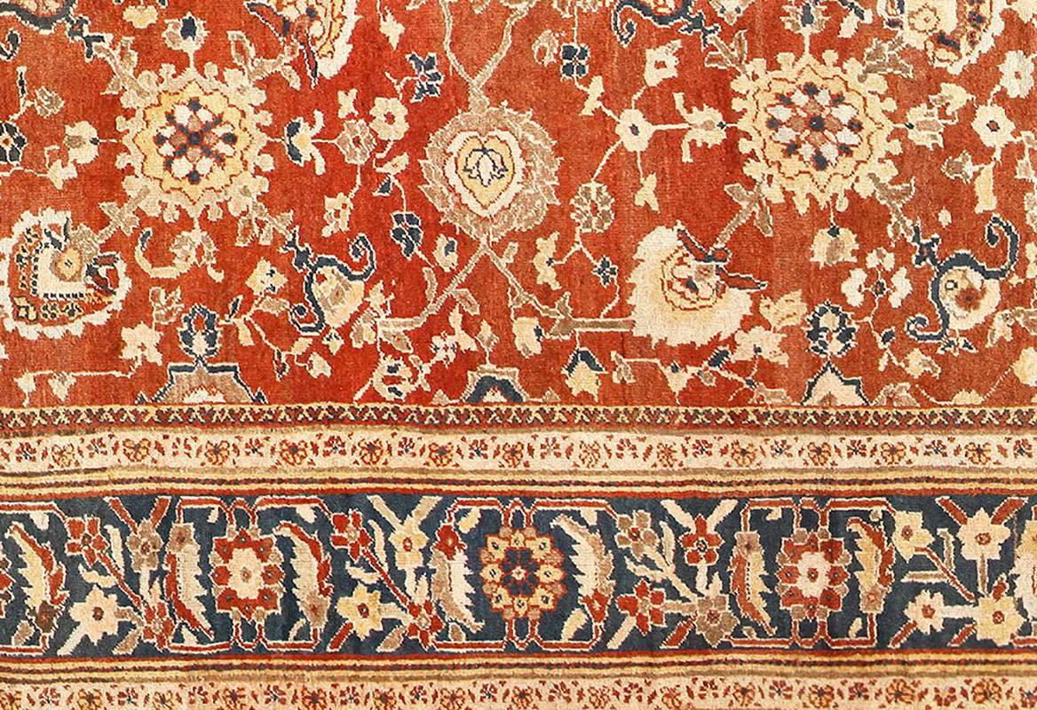 Beautiful Large Oversized Rust Color Antique Sultanabad Rug, Country of Origin / Rug Type: Antique Persian Rug, Circa Date: Late 19th Century – Size: 12 ft 3 in x 23 ft 5 in (3.73 m x 7.14 m)

This elegant, rich antique Sultanabad carpet was created