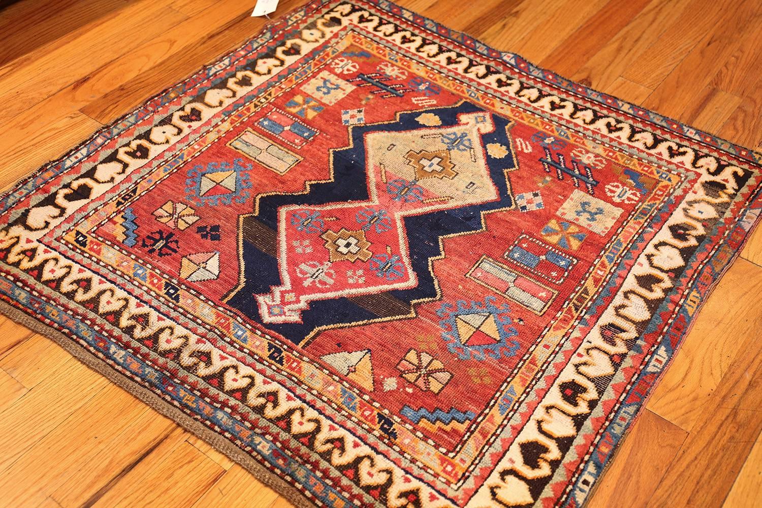 Beautiful antique tribal square Caucasian Kazak rug 49204, country of origin / rug type: Caucasian rug, date circa 1900. This antique Caucasian rug, utilizing a dynamic square shape, fills any space with a lively and attractive display. Emblazoned