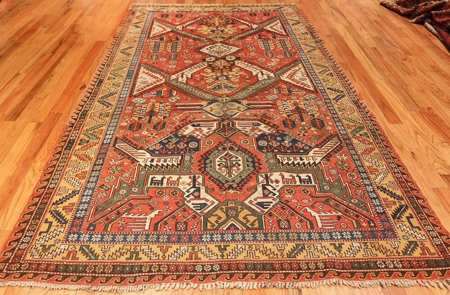 Antique Red Background Soumak Caucasian Rug. Size: 5 ft 9 in x 10 ft 2 in  2
