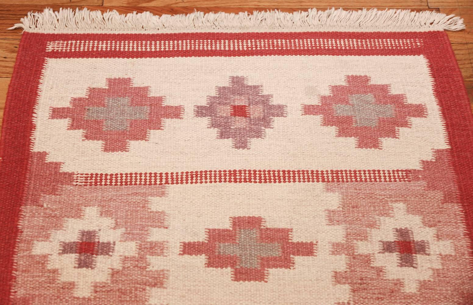 Beautiful and quite rare vintage flat-woven Swedish Kilim runner rug, country of origin / rug type: Scandinavian rugs, date circa mid-20th century. Proving that a monochrome theme need not lack for vibrancy, this vintage Scandinavian rug displays a
