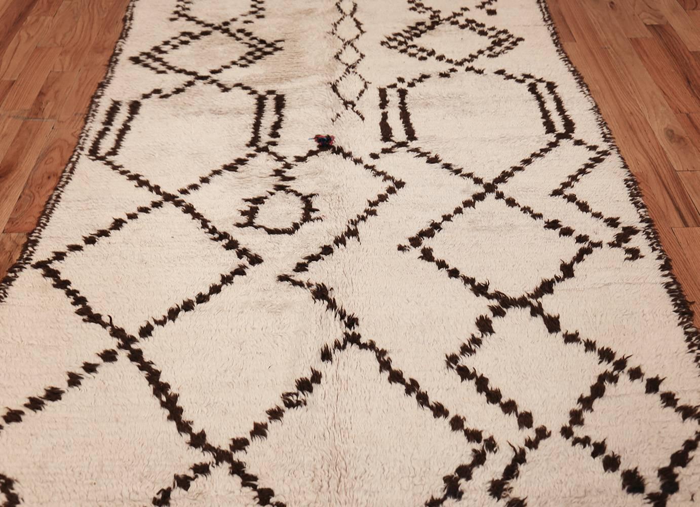 Vintage Moroccan Rug, Origin: Morocco, Circa: Mid 20th Century – Size: 4 ft 6 in x 10 ft 6 in (1.37 m x 3.2 m)

Woven in Morocco during the mid-20th century, this extraordinary vintage rug showcases an inventive composition with multiple large-scale