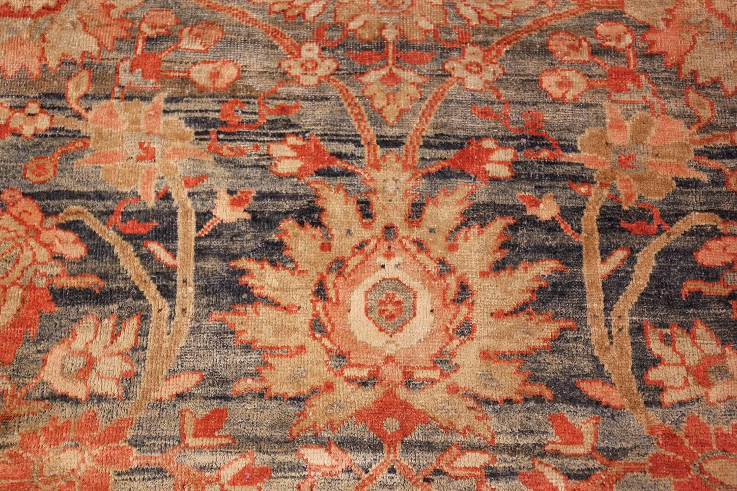 Breathtaking blue background antique Sultanabad Persian rug 49320, country of origin / rug type: Persian rug, date: circa 1900. This Persian Sultanabad rug has a more traditional design and incorporates colors that is sure to complement the colors
