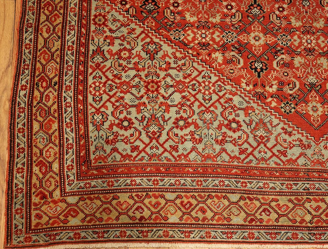 This gorgeous Senneh rug, with its fantastic monumental central medallion, is an absolute delight in a dazzling array of reds.

Fine antique Persian Senneh rug, Origin: Persia, circa 1880. This masterful composition is an exemplary antique Persian