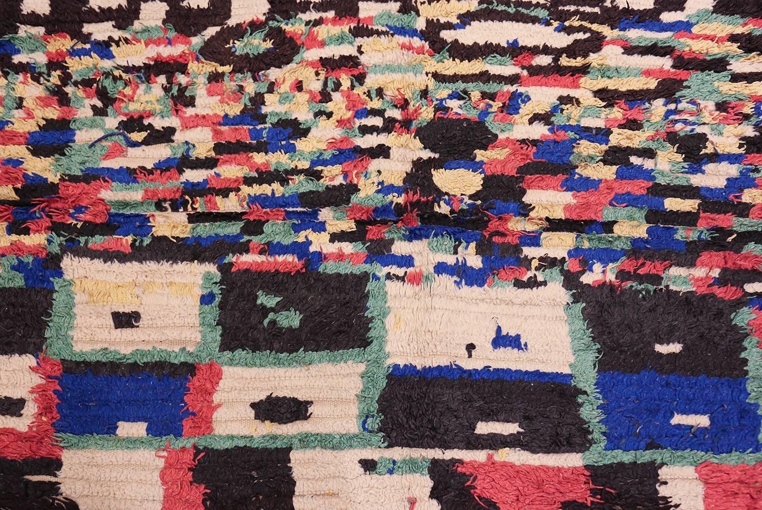Vintage Moroccan Rug, Country of Origin: Morocco, Circa Date: Mid 20th Century – Size: 4 ft 6 in x 5 ft (1.37 m x 1.52 m)

Showcasing a phenomenal combination of texture and color, this vibrant Moroccan rug is decorated with a fantastic variety of