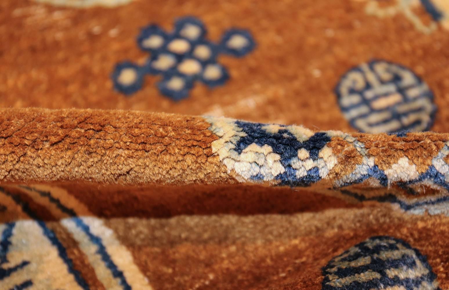 Beautiful small size antique blue with brown Chinese rug, country of origin / rug type: China rug, date circa 1920s – This small, brown antique Chinese rug will add a sense of simplicity and earthiness to the room. This small scatter size rug is the