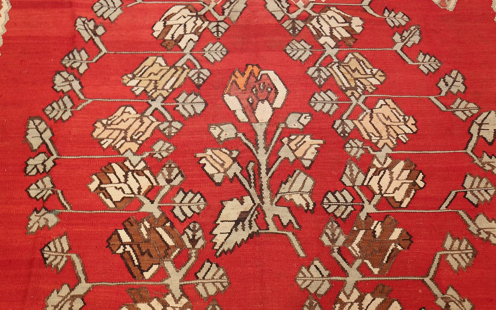 Beautiful Floral Vintage Mid Century Turkish Kilim Rug, Country of Origin / Rug Type: Turkish Rug, Circa Date: 1940's. Size: 8 ft x 9 ft 3 in (2.44 m x 2.82 m)

This vintage Turkish rug features an angular design depicting a wide spread of flowers